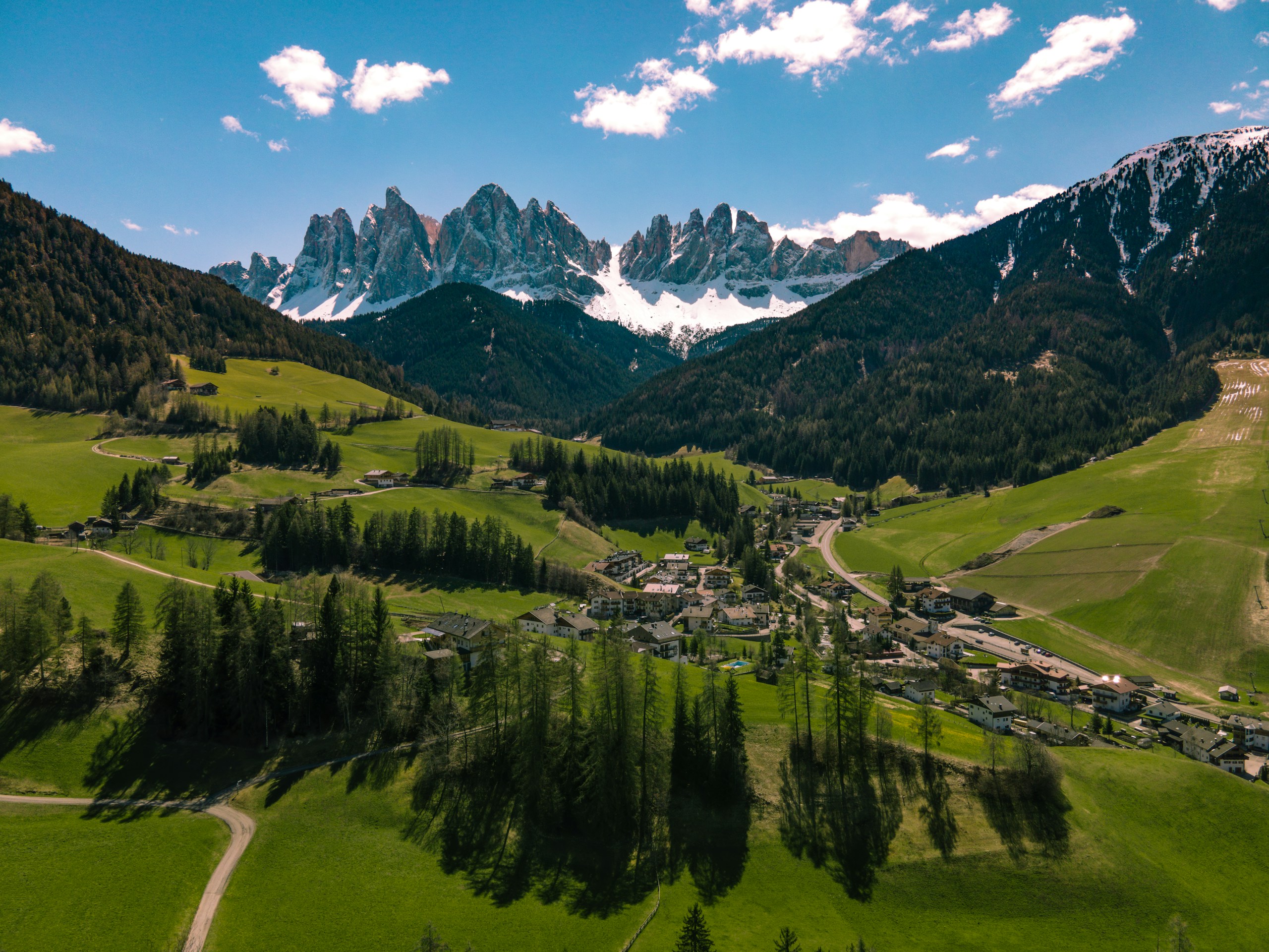 Aerial view of a mountain village in the Dolomites HD Wallpaper