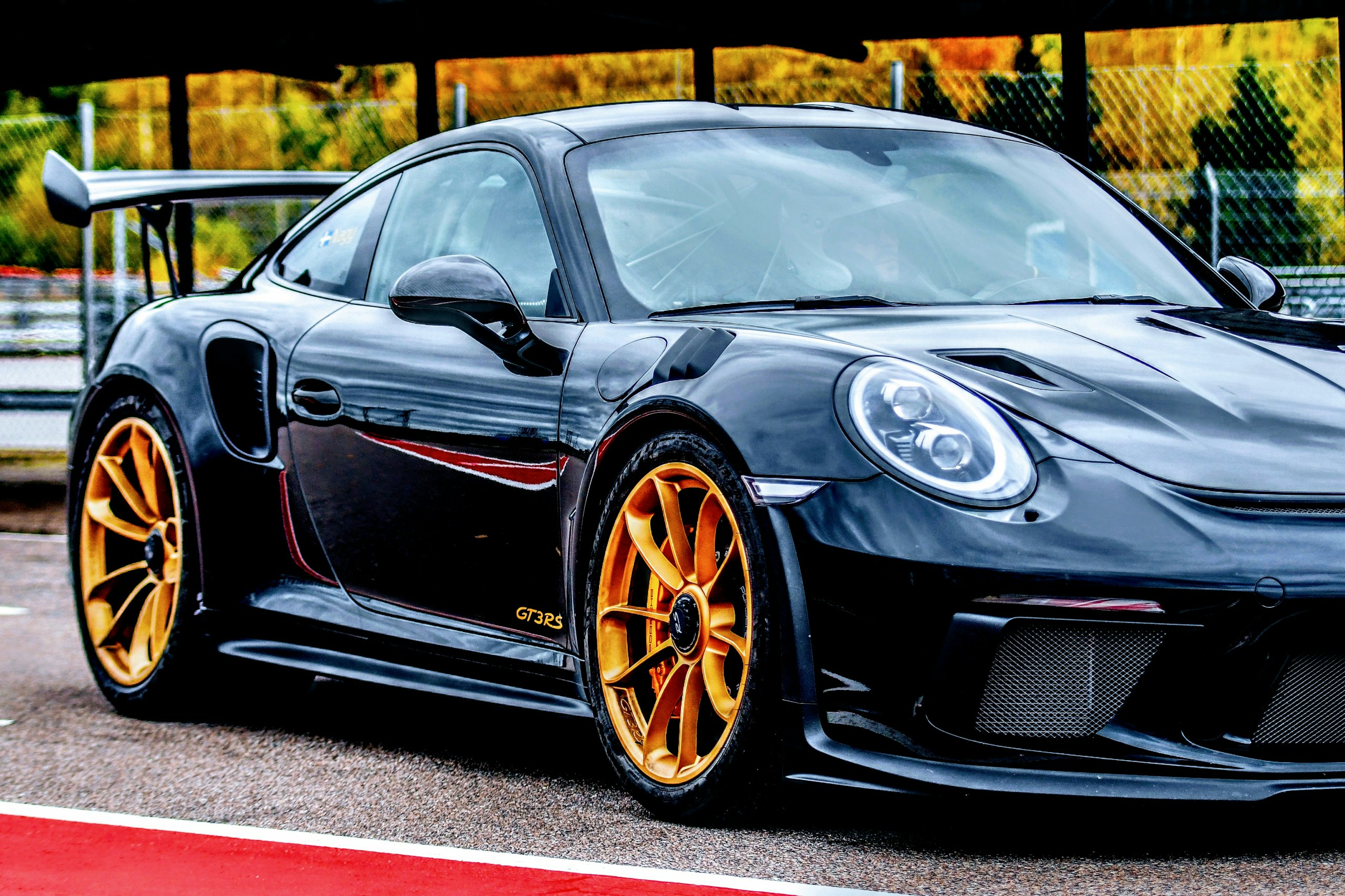 Black Porsche GT3 RS with Gold Wheels on Track HD Wallpaper