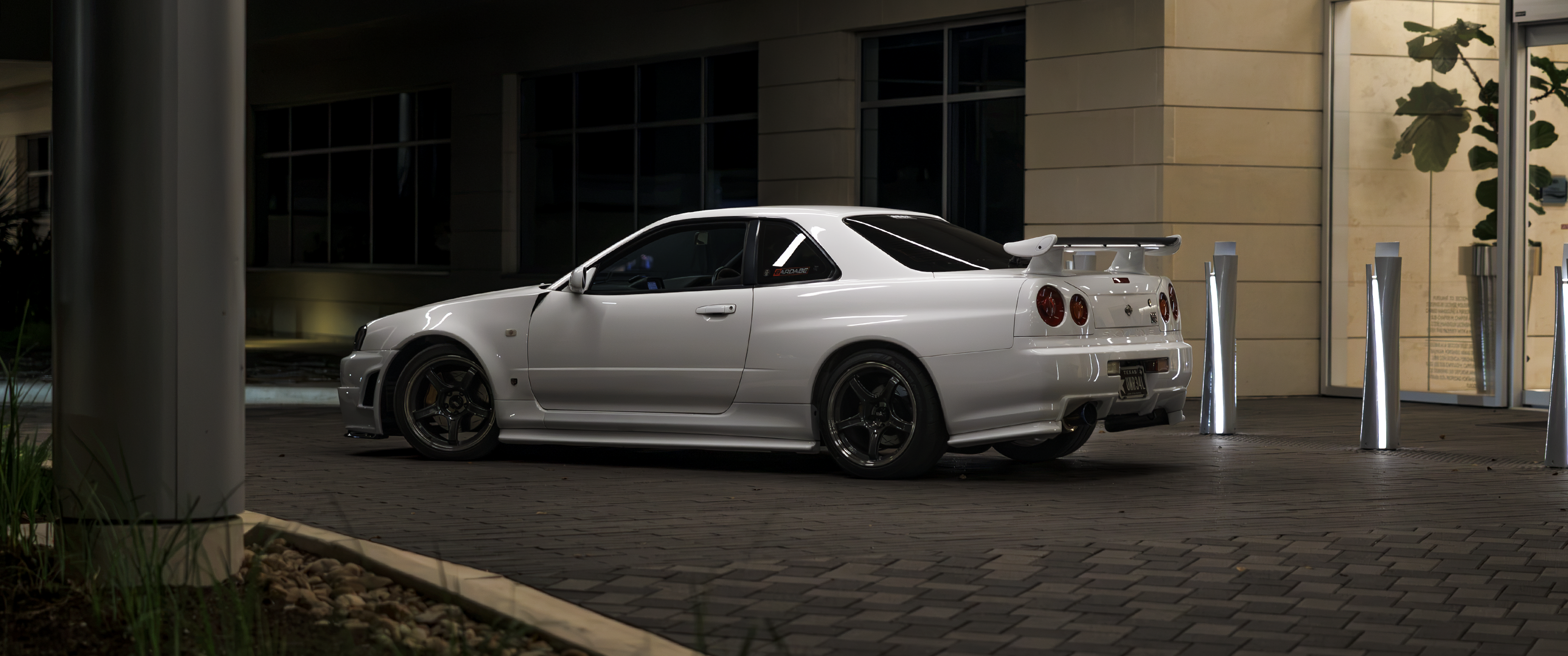 White Nissan Skyline R34 GT-R parked at night HD Wallpaper