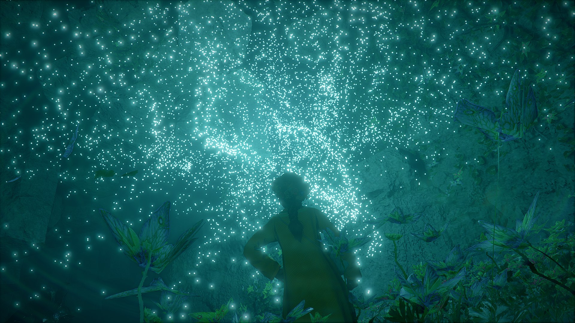 Person looking up at glowing particles in a cave HD Wallpaper