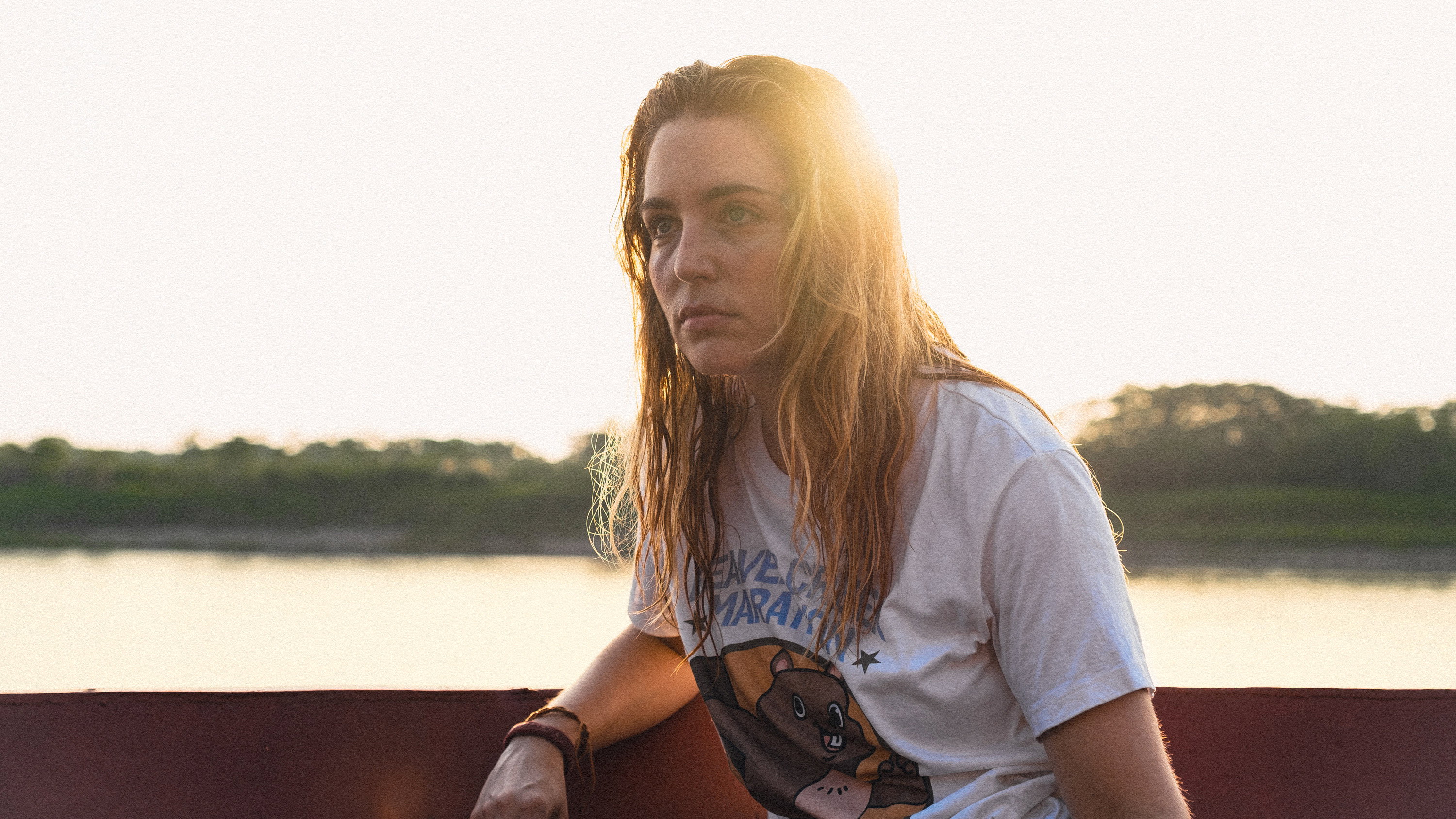 Woman on a boat at sunset HD Wallpaper