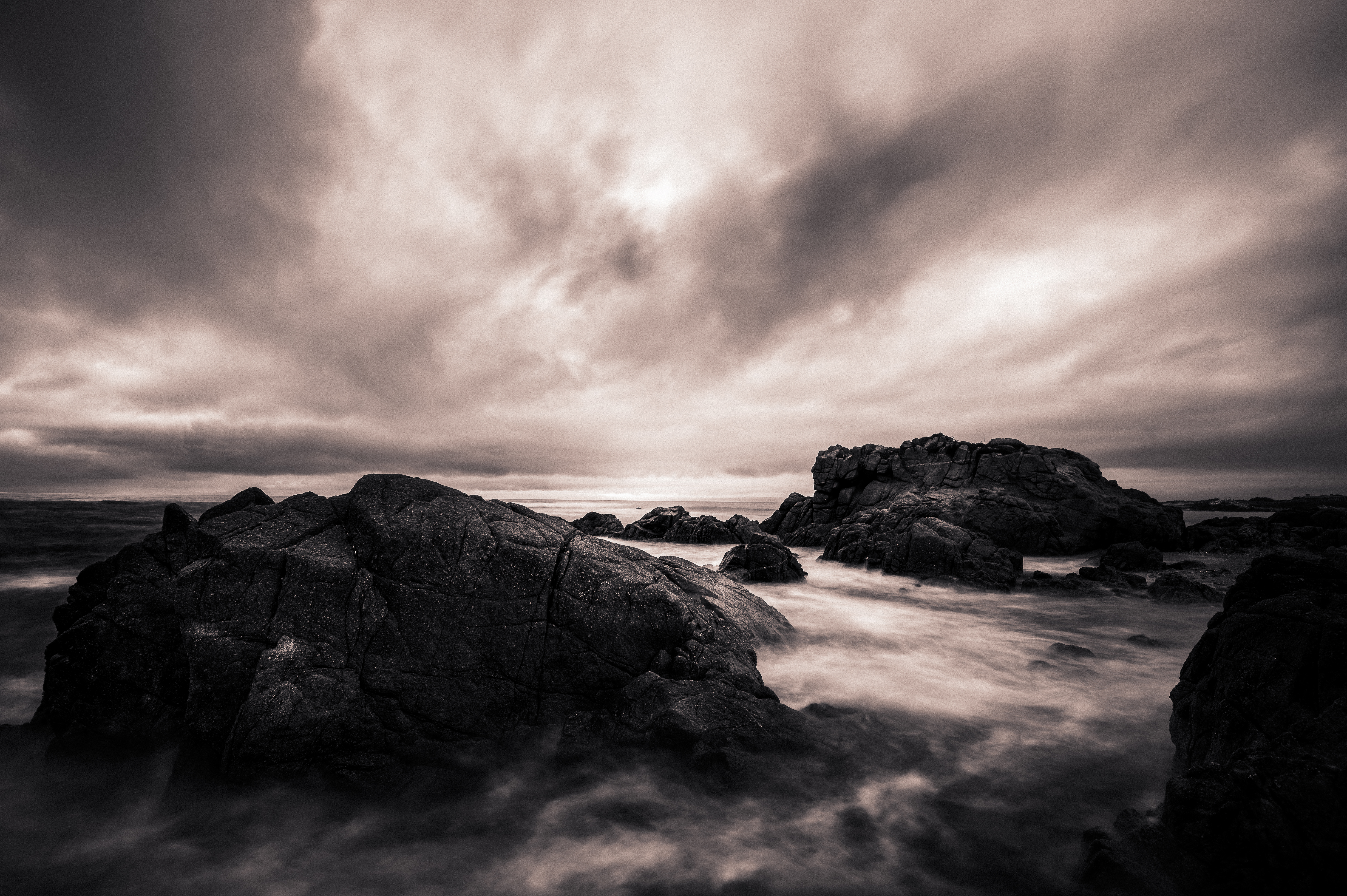 Dramatic Seascape with Jagged Rocks and Moody Clouds HD Wallpaper