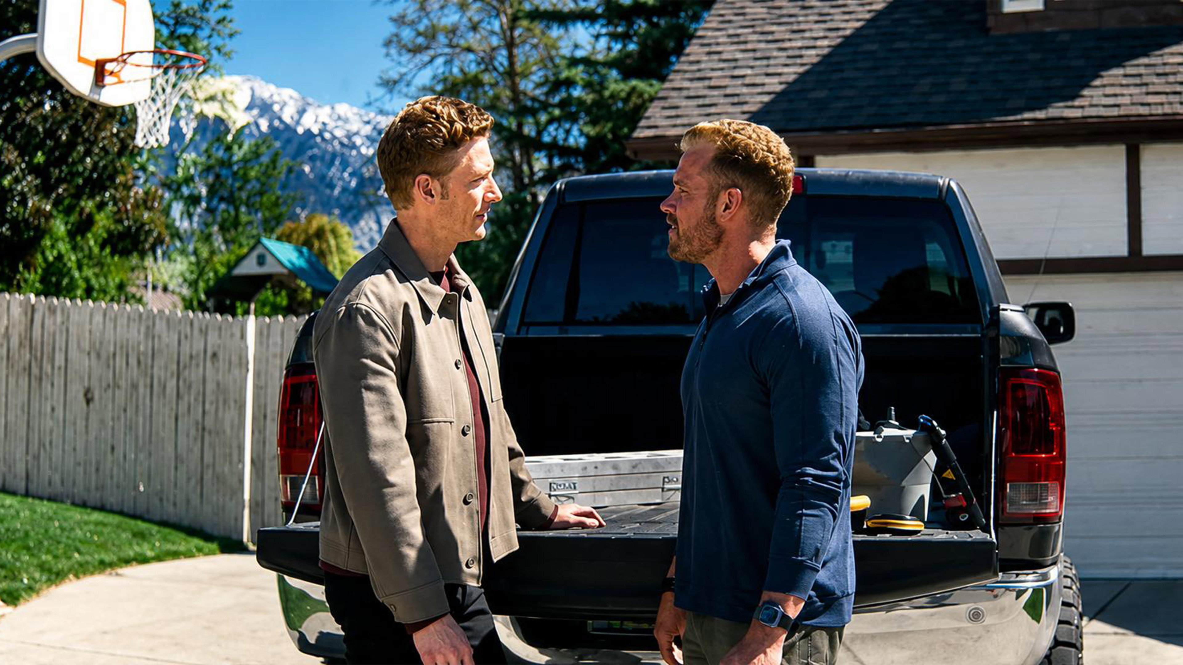 Two men talking by a pickup truck HD Wallpaper