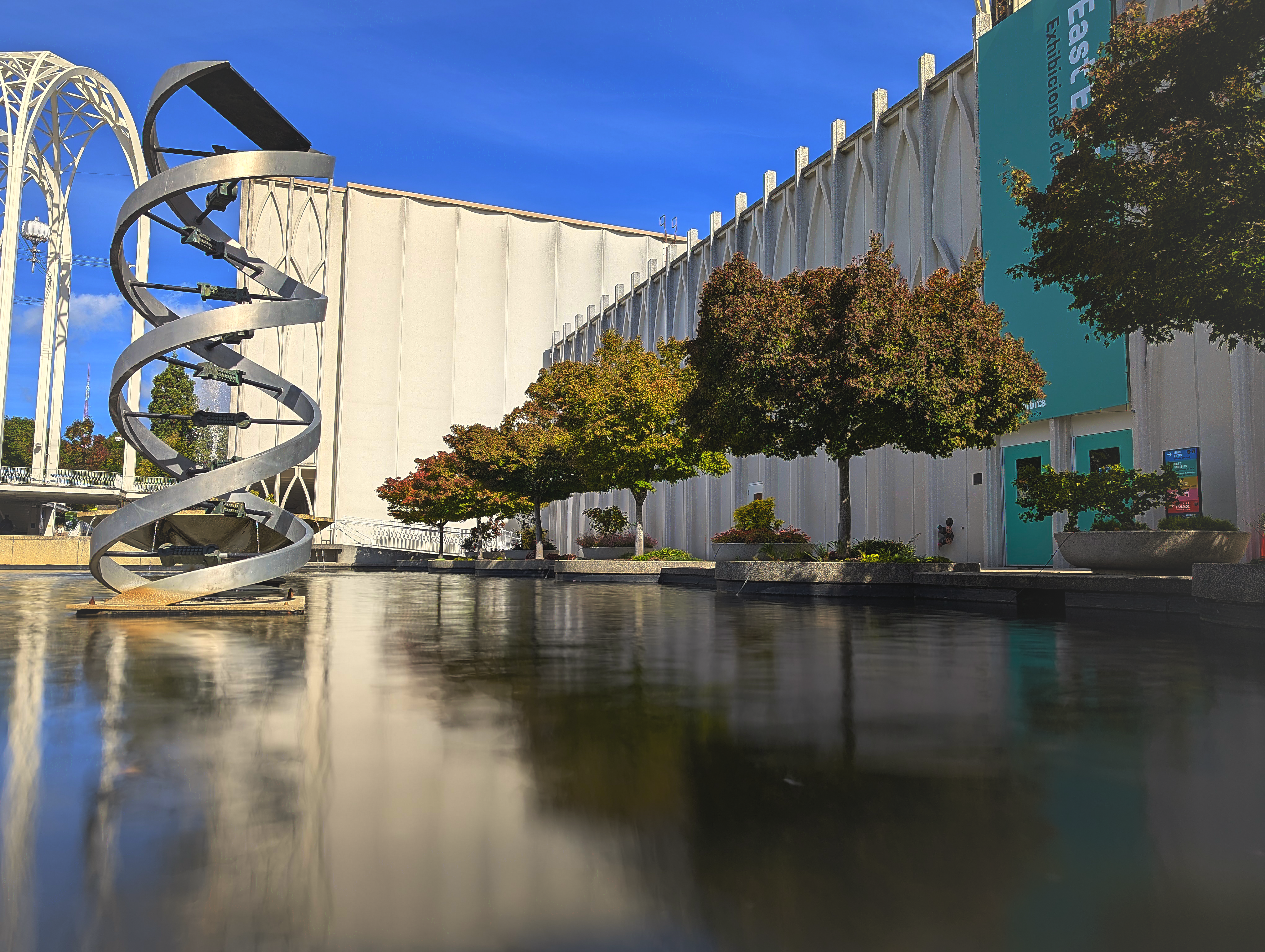 DNA Sculpture and Reflection in Water HD Wallpaper