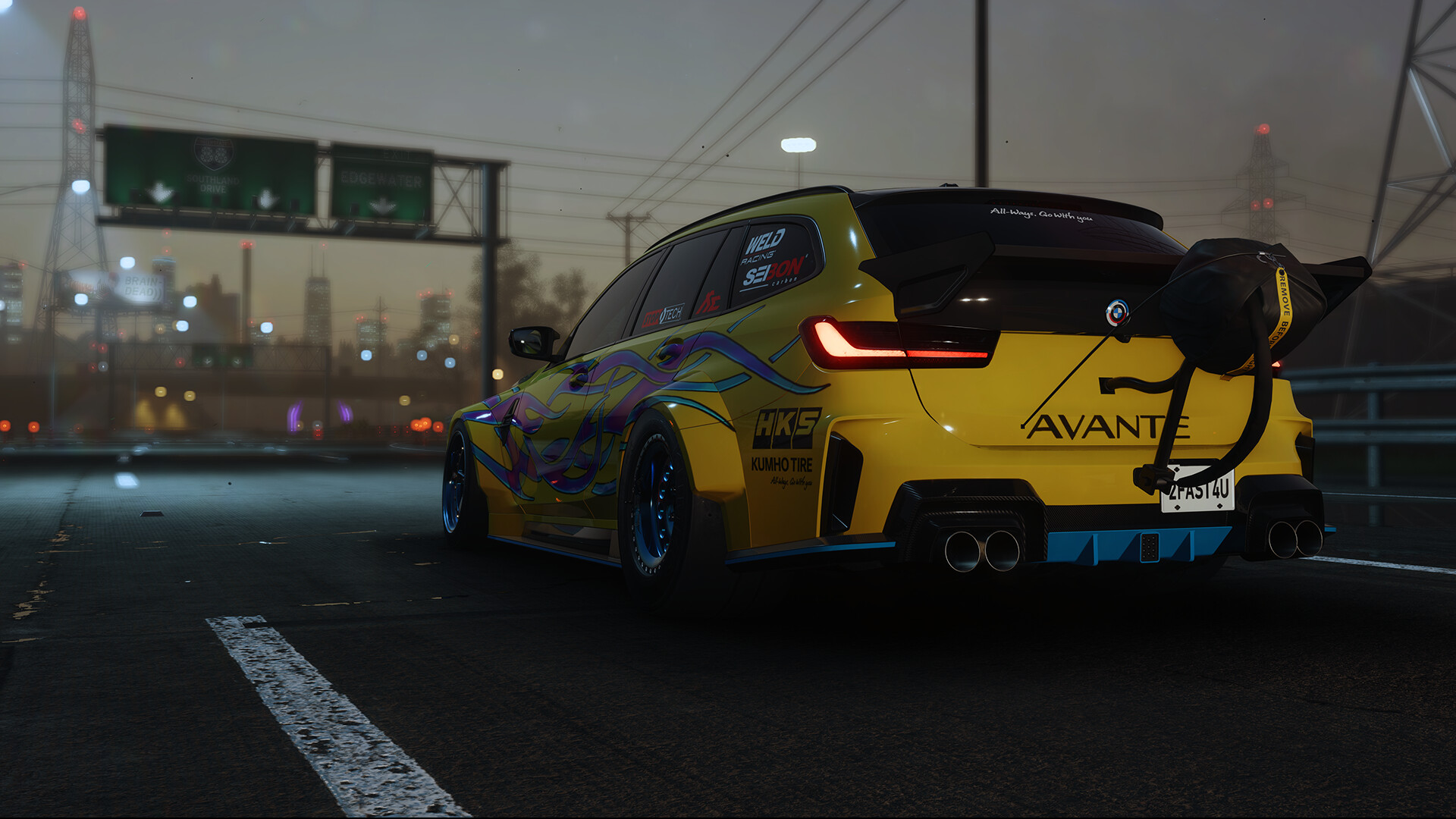 Yellow modified station wagon on a highway at dusk HD Wallpaper