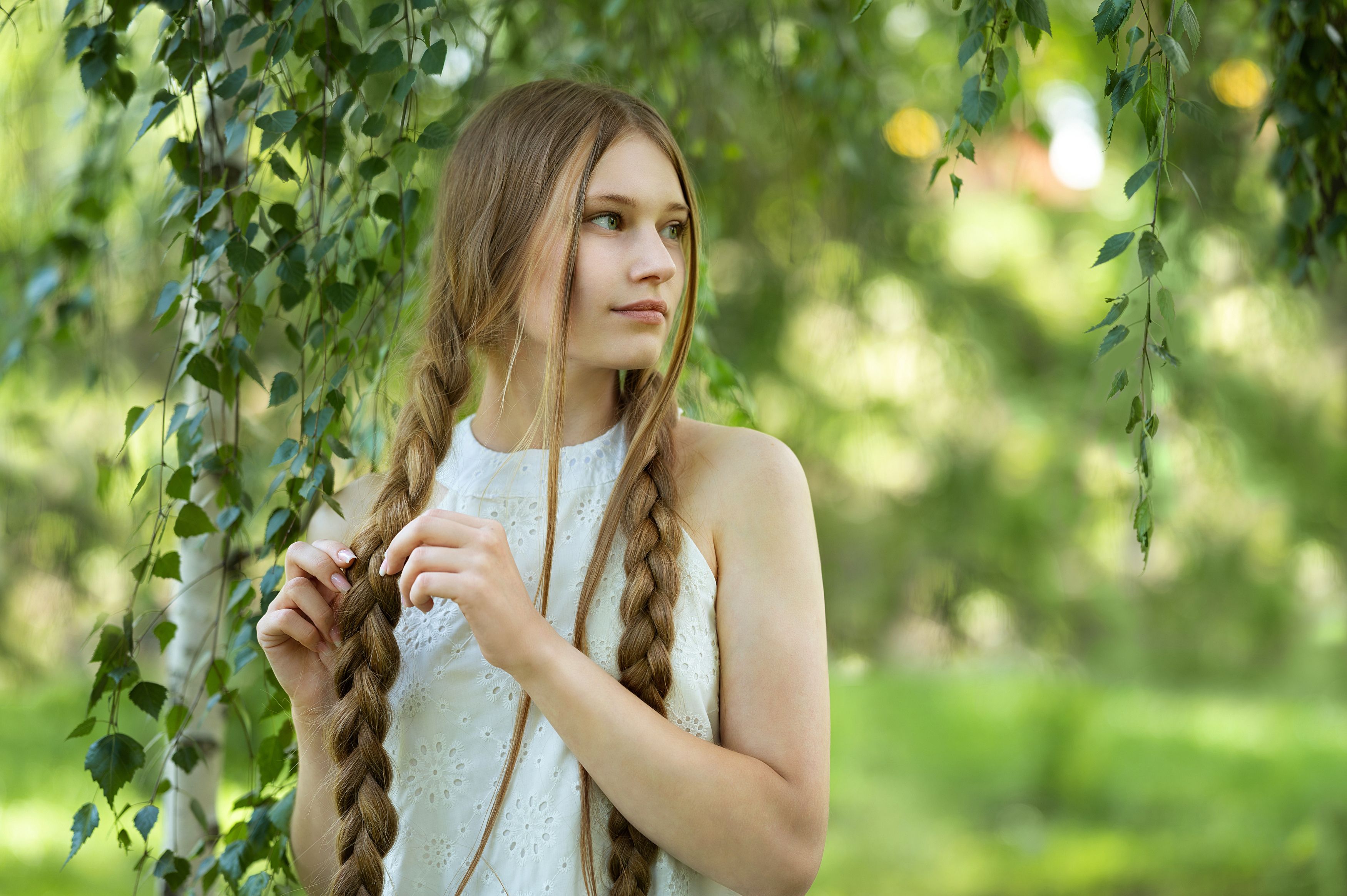 Young woman with braided hair in nature HD Wallpaper