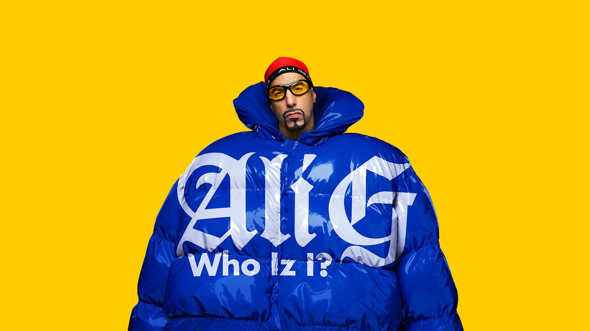 Ali G in a large blue puffer jacket HD Wallpaper