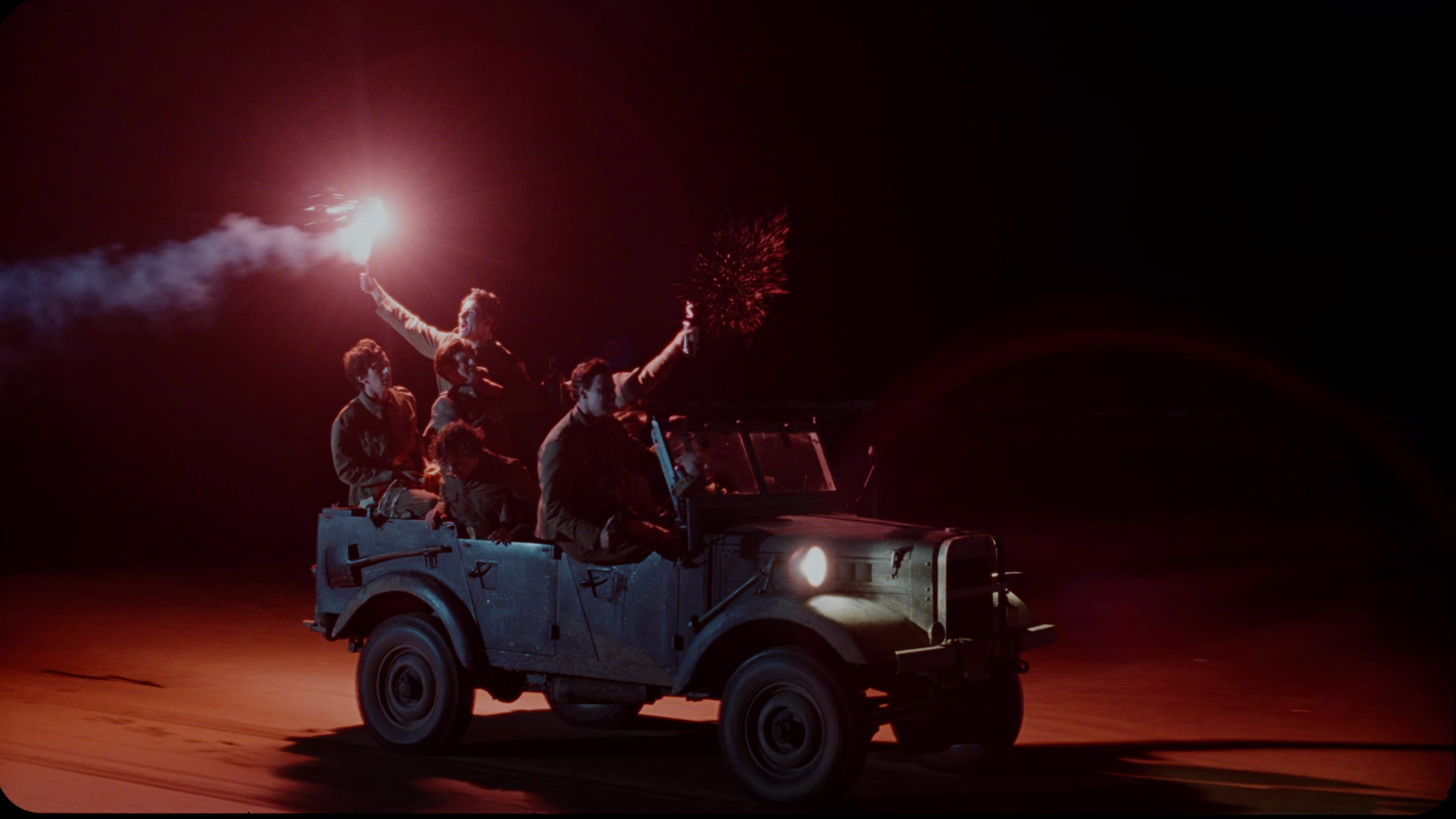 Men in a jeep with flares at night HD Wallpaper