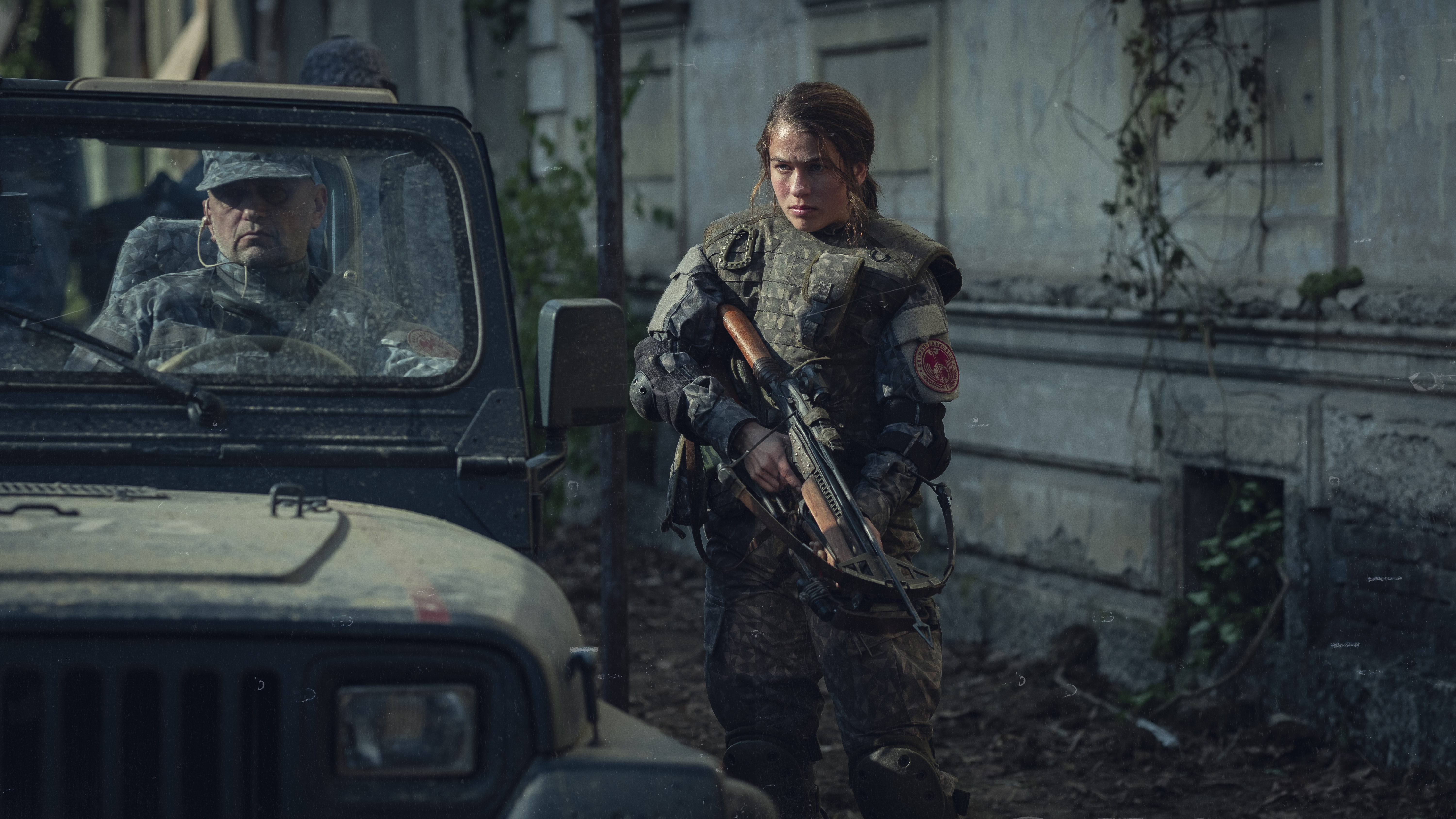Woman with rifle and man in jeep from Tribes of Europa 4K HD Wallpaper