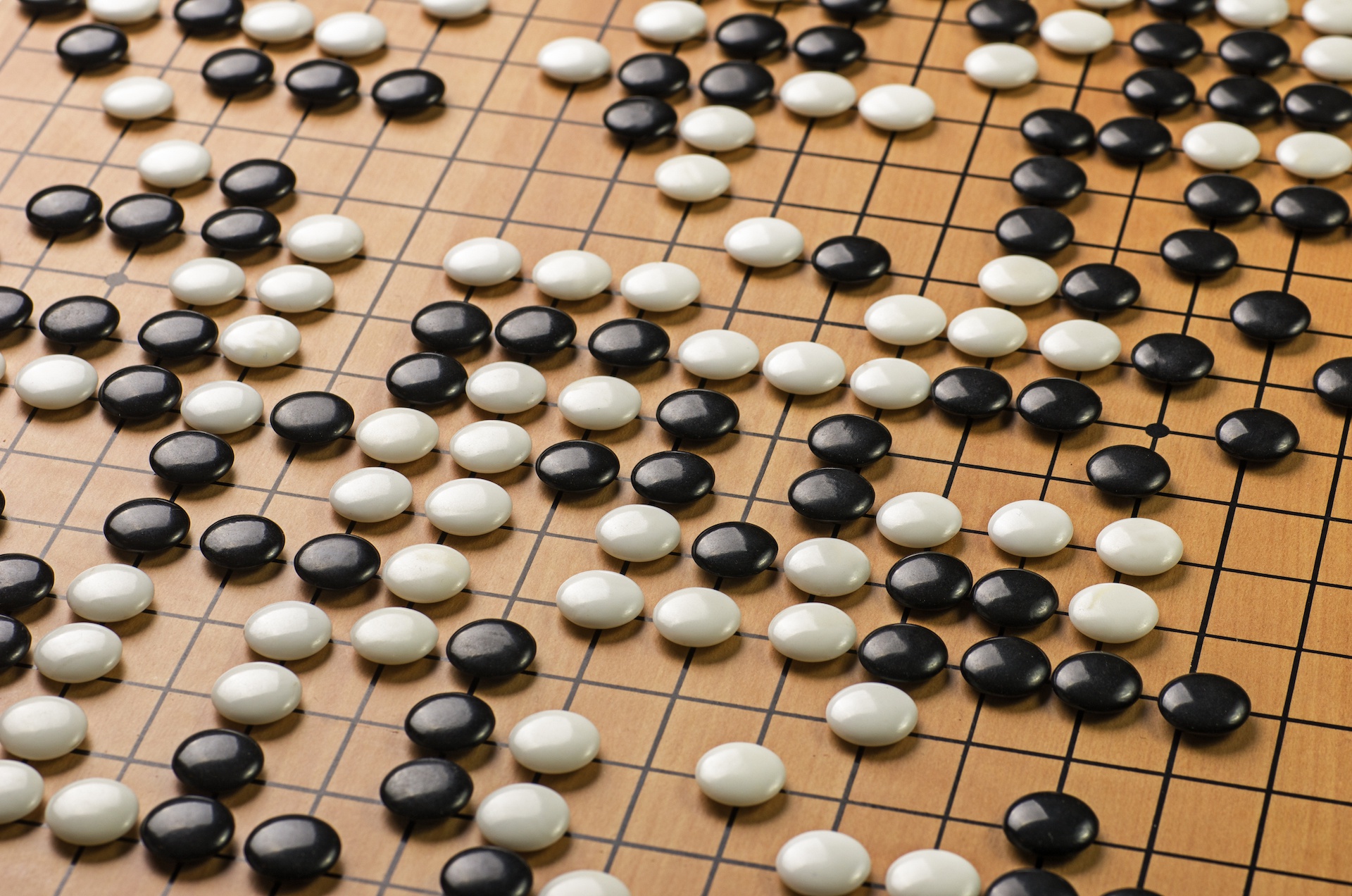 Go board with black and white stones HD Wallpaper