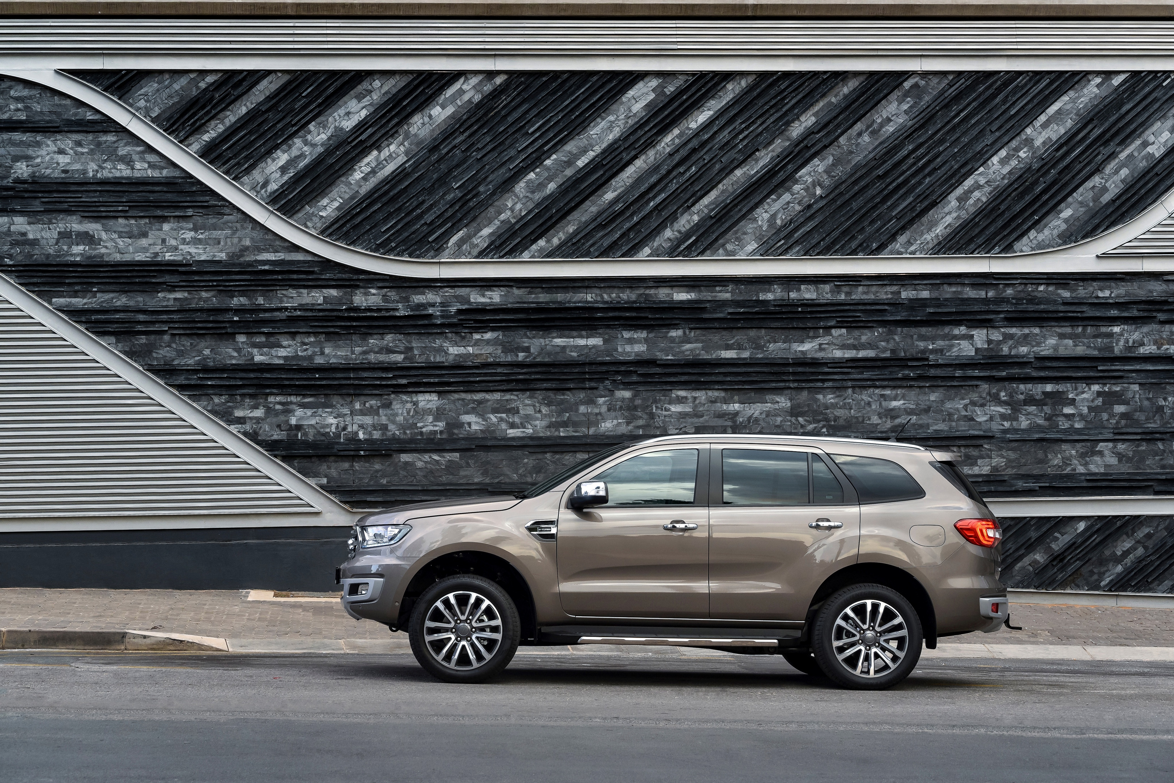 Ford Everest SUV parked by a modern building HD Wallpaper