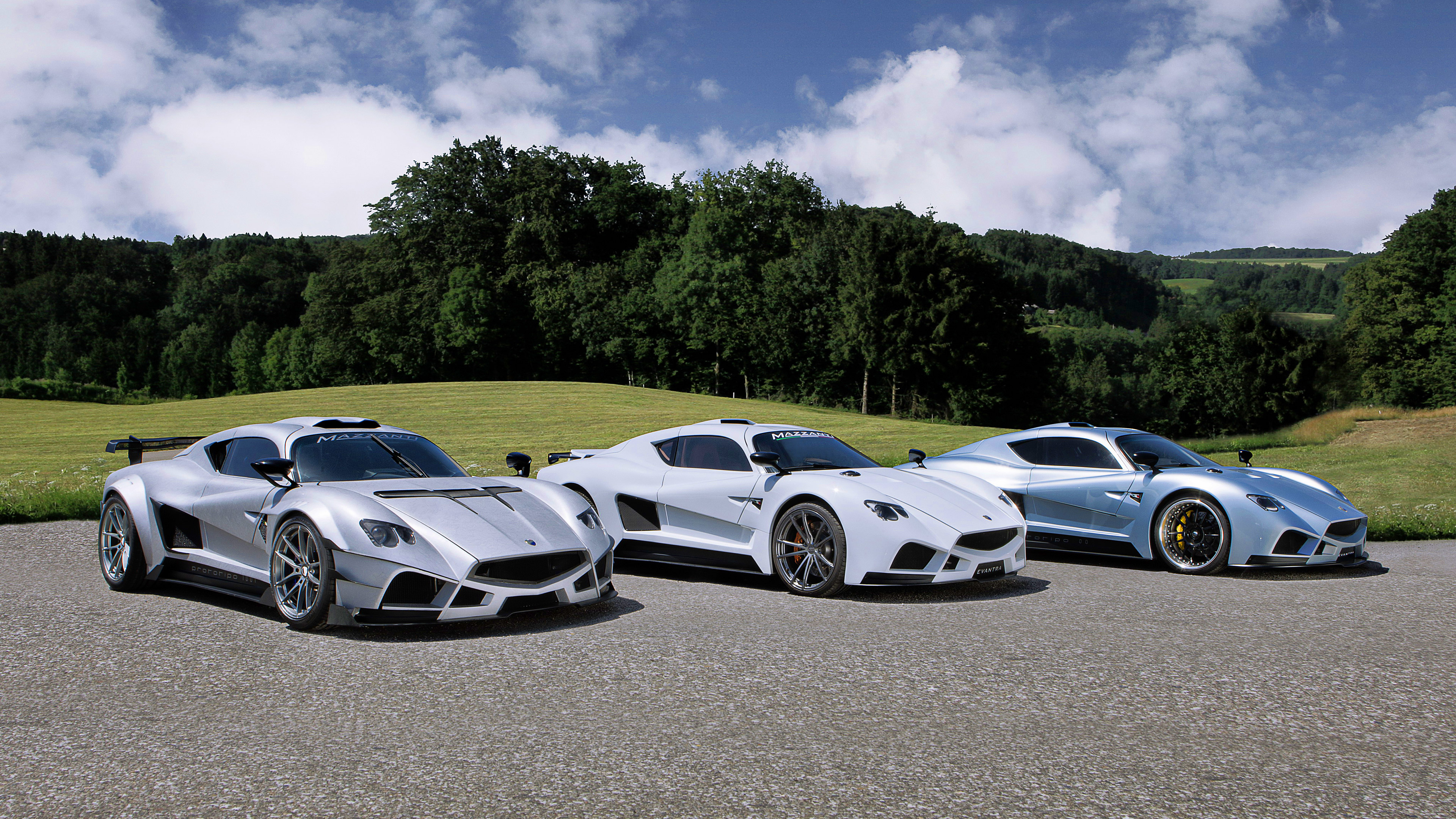 Three Mazzanti Evantra Millecavalli sports cars on a road HD Wallpaper
