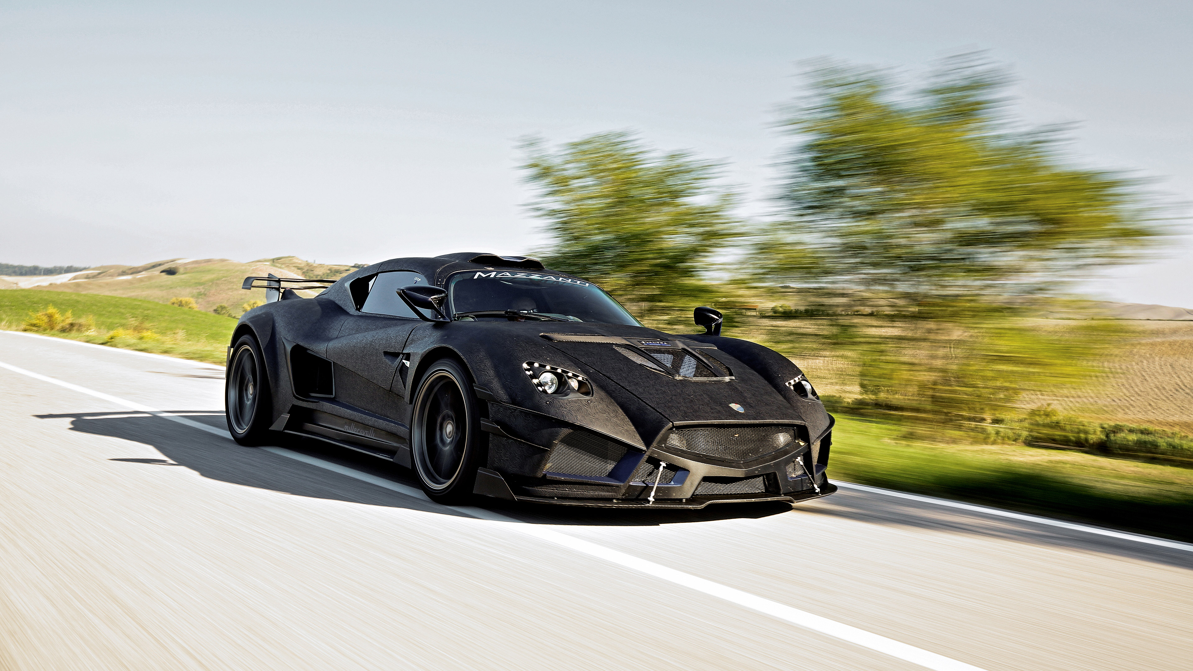 Mazzanti Evantra Millecavalli driving on a road HD Wallpaper