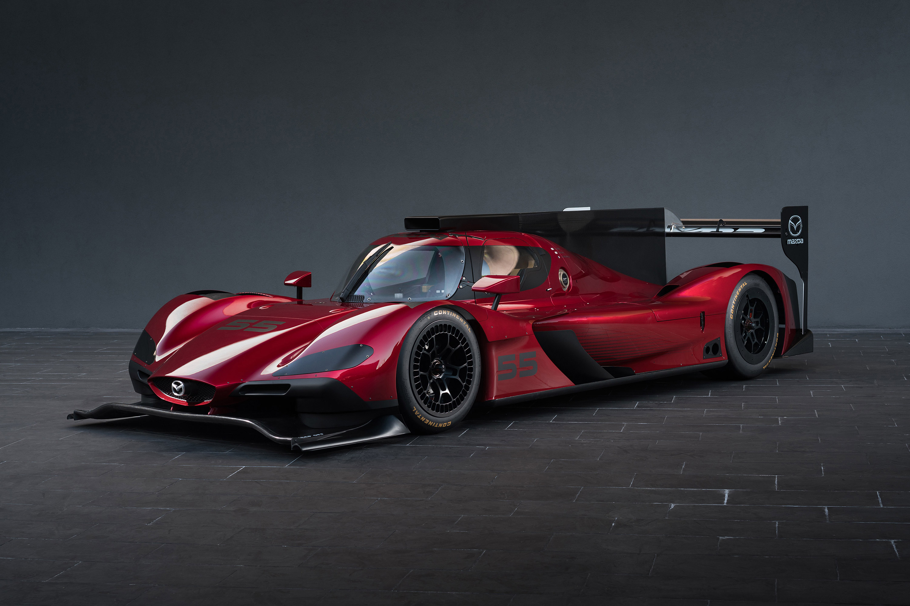 Red Mazda RT24-P race car HD Wallpaper