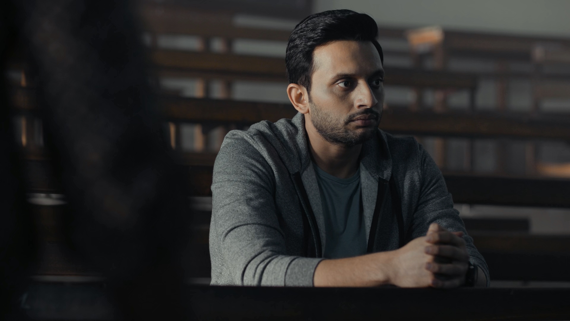 Man sitting in lecture hall HD Wallpaper