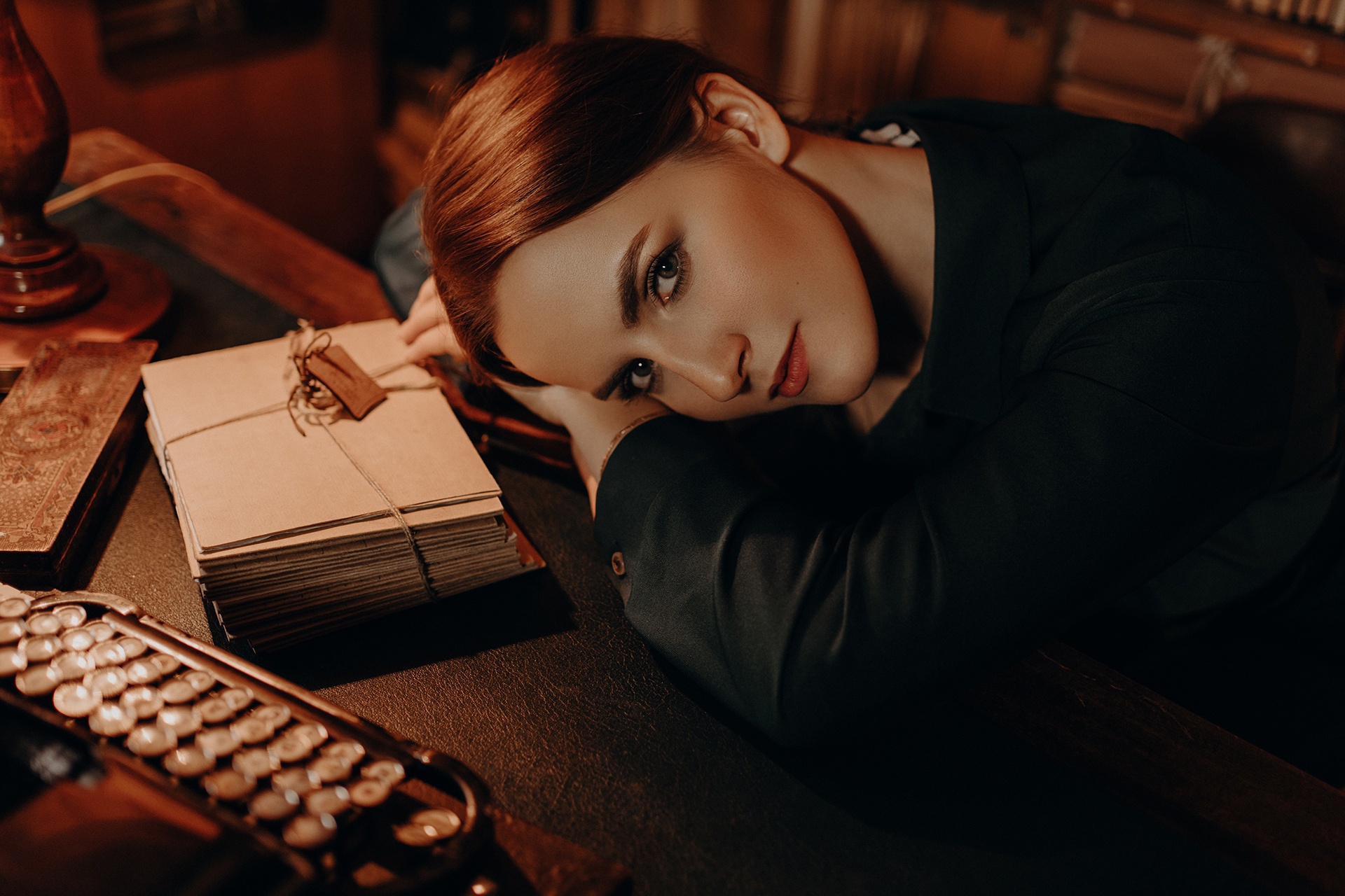 Woman with red hair resting head on desk HD Wallpaper