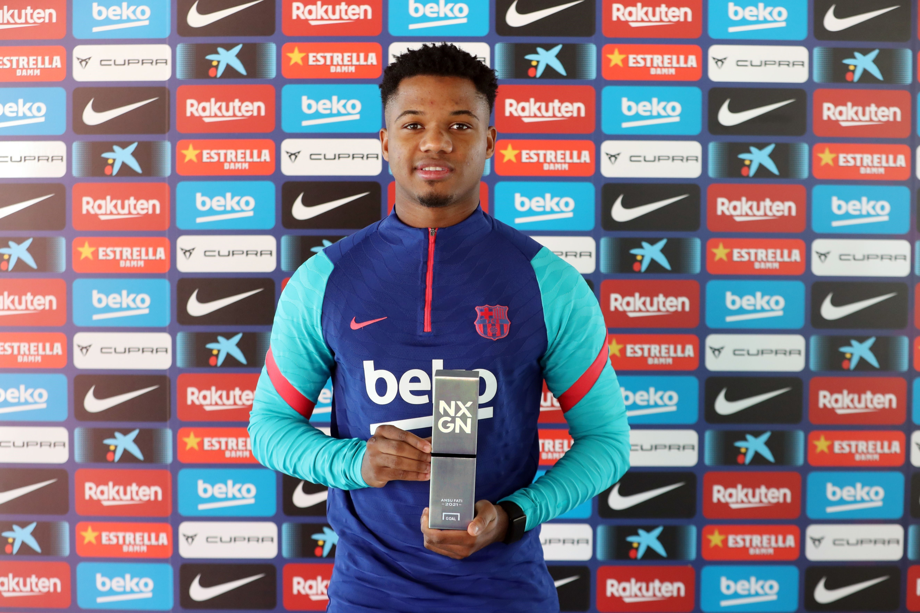 Ansu Fati holding an award HD Wallpaper