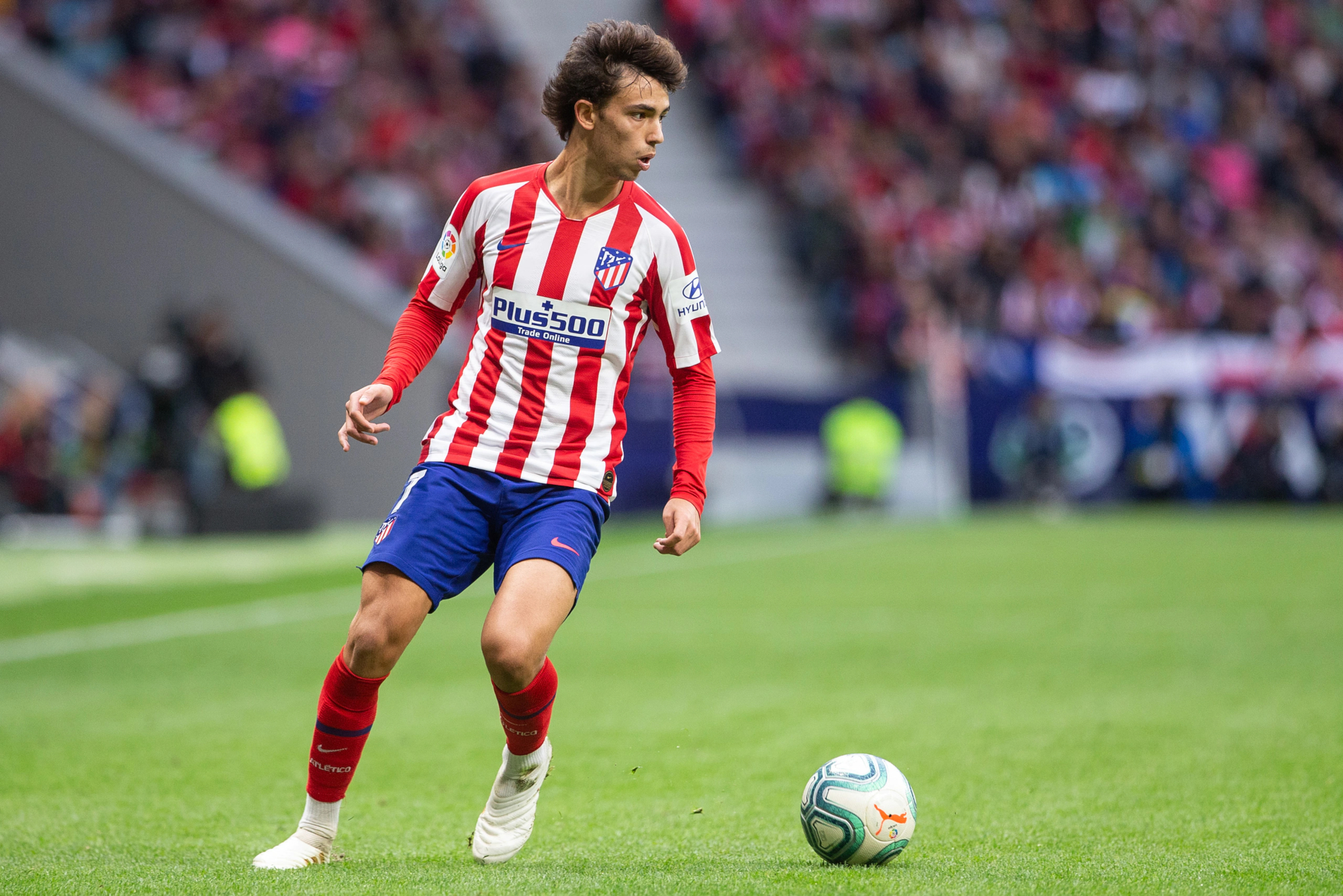 Joao Felix playing soccer for Atletico Madrid HD Wallpaper