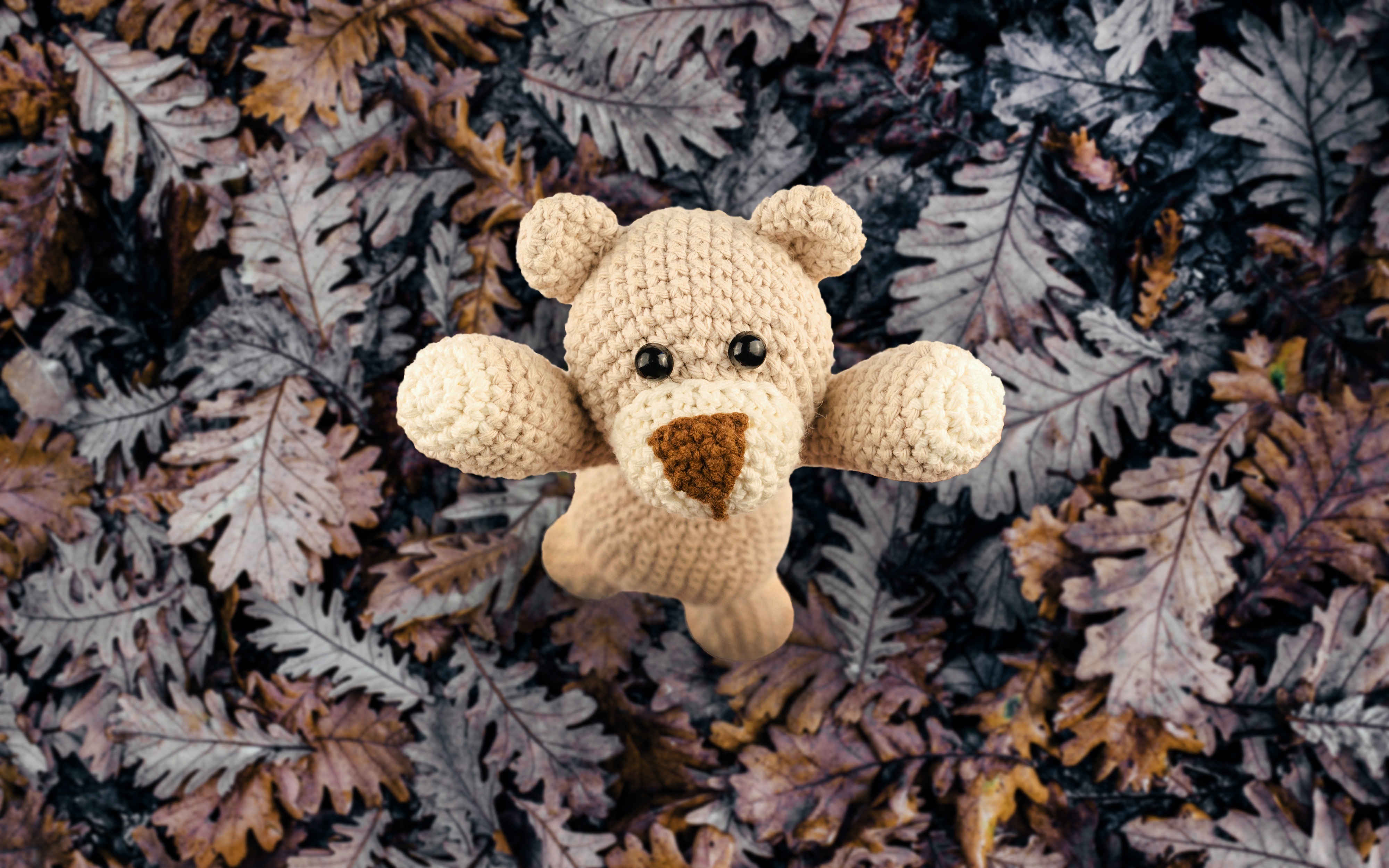 Crocheted Teddy Bear on Autumn Leaves 4K HD Wallpaper