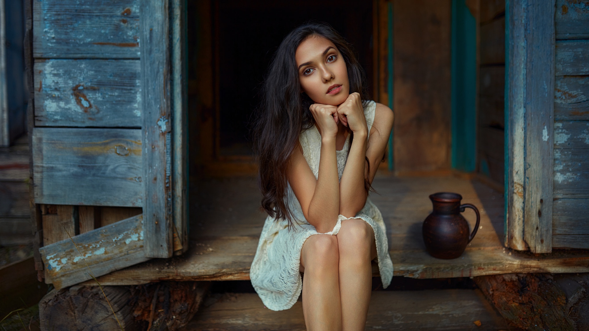 Woman with black hair sitting on porch HD Wallpaper