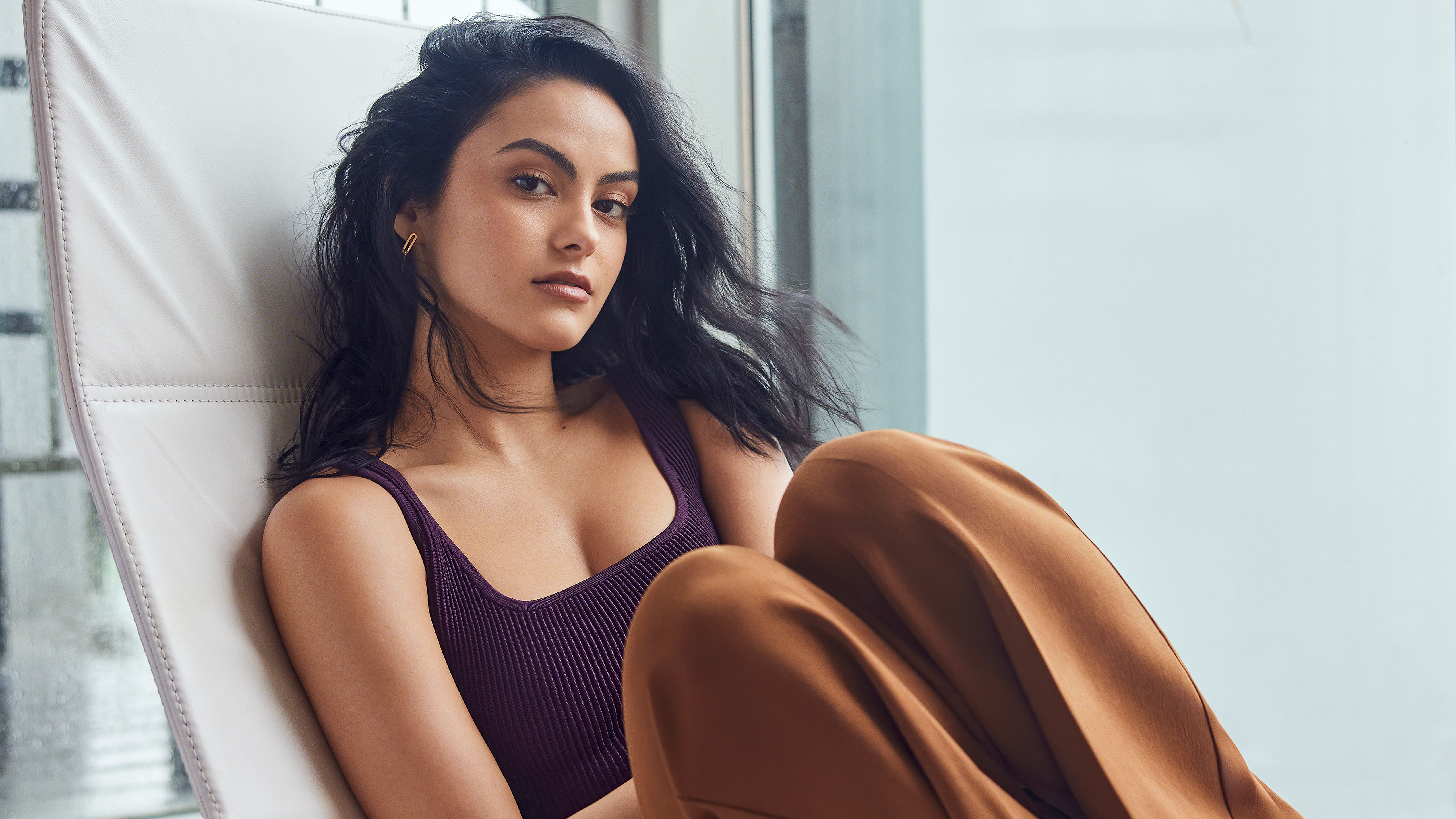 Camila Mendes in a purple top and brown pants HD Wallpaper
