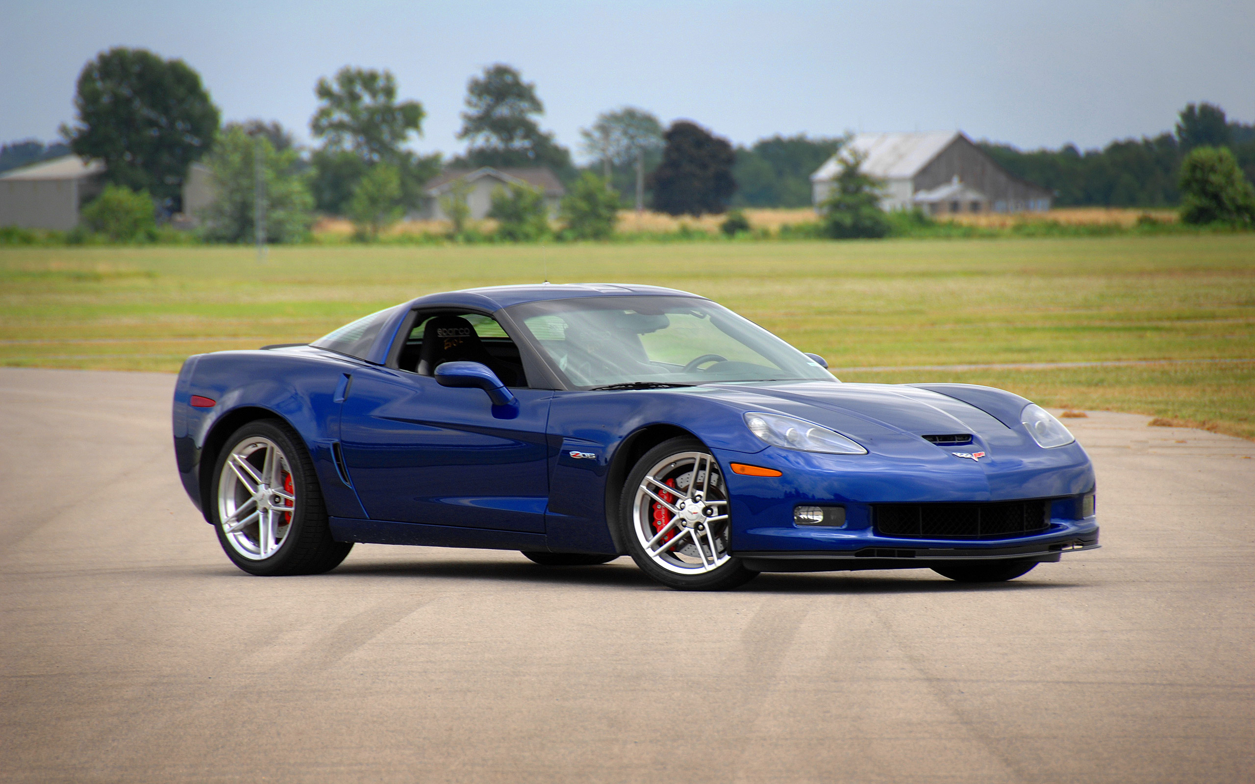 Blue 2006 Chevrolet Corvette Z06 Coupe on a Racetrack HD Wallpaper
