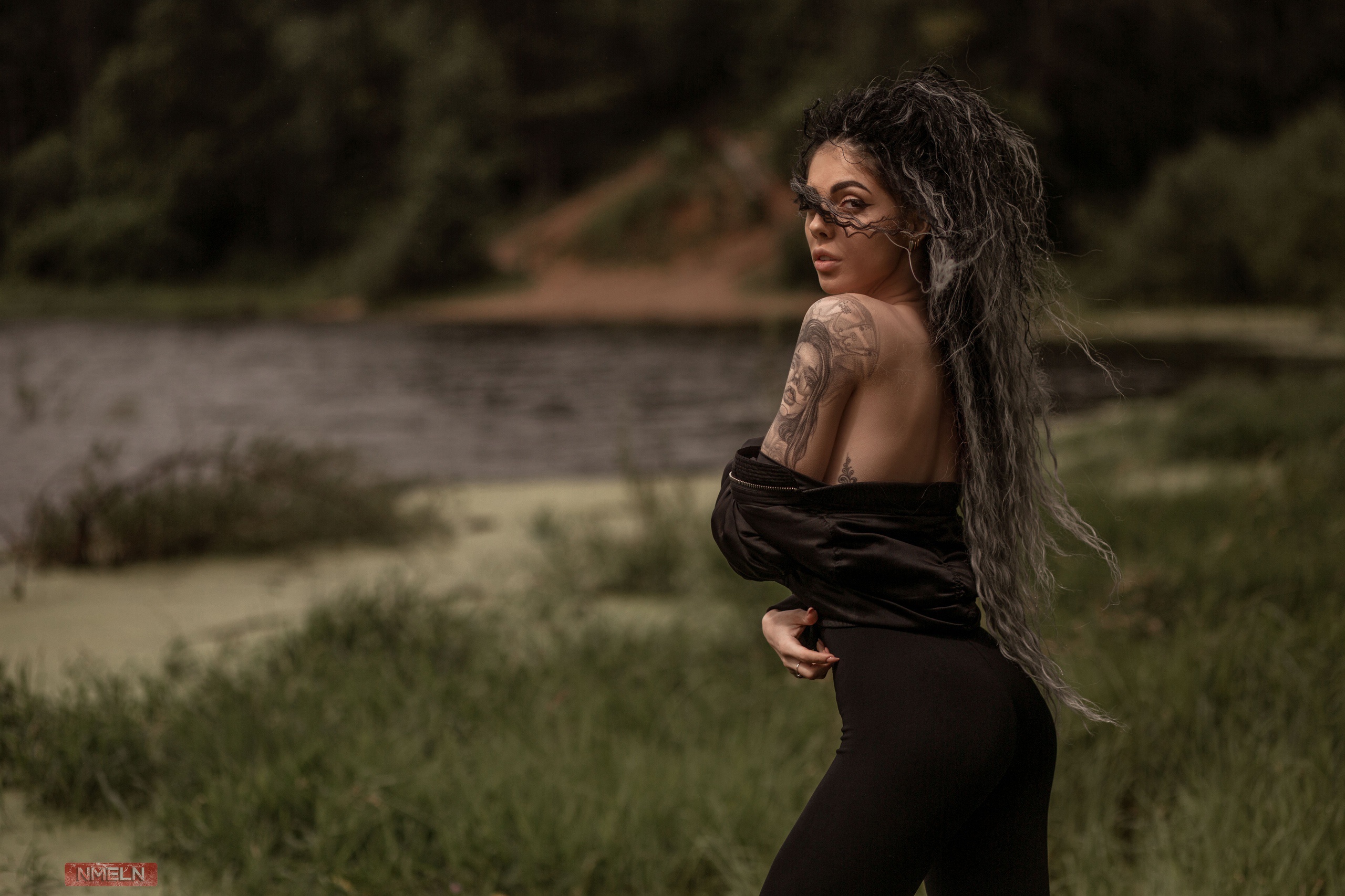 Woman with tattoos and long hair in black dress HD Wallpaper