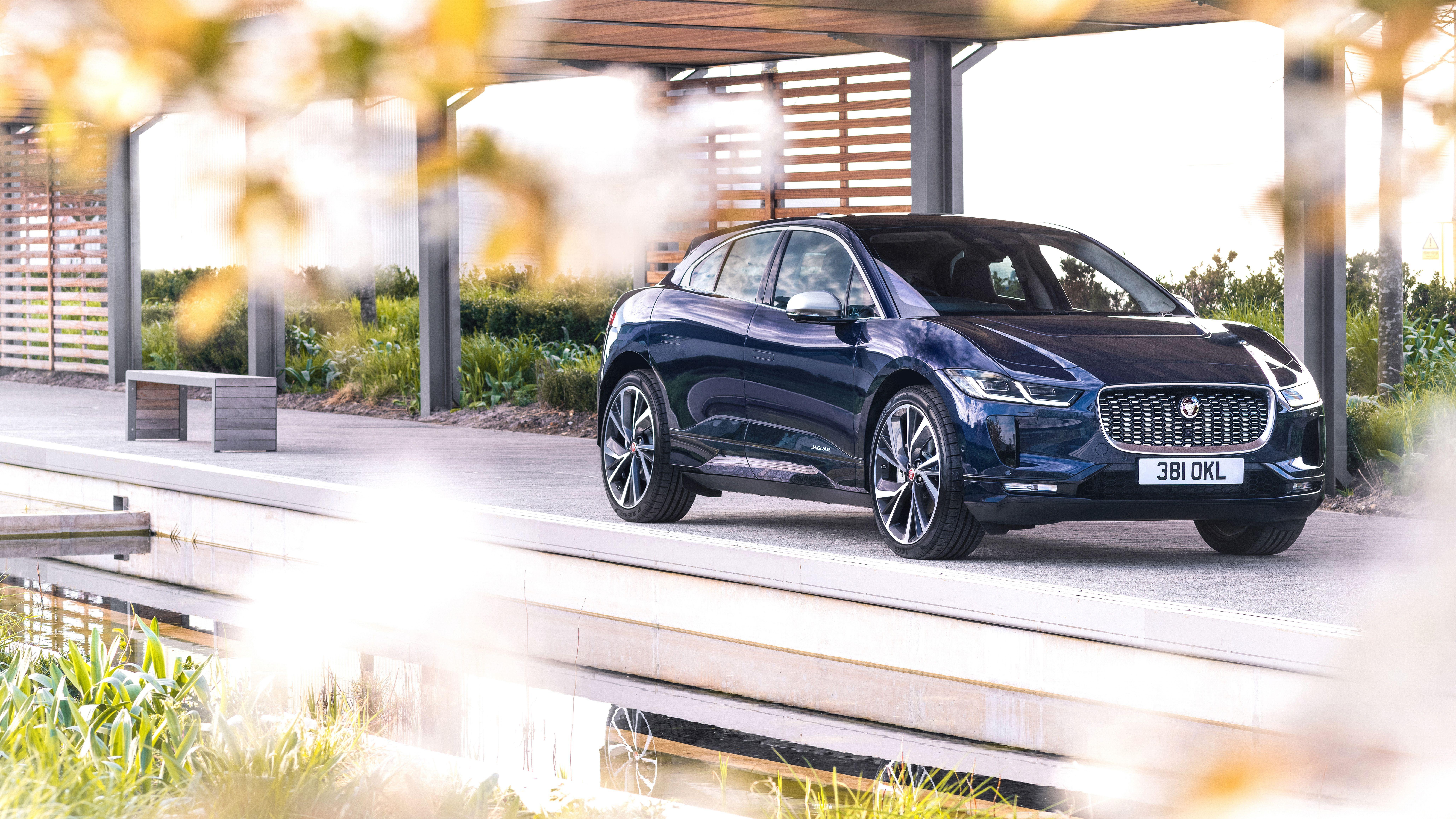 Blue Jaguar I-Pace SUV parked outdoors HD Wallpaper