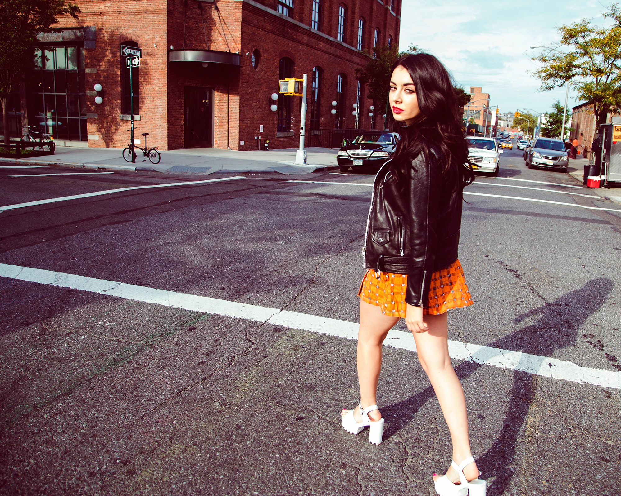 Charli XCX walking in a city street HD Wallpaper