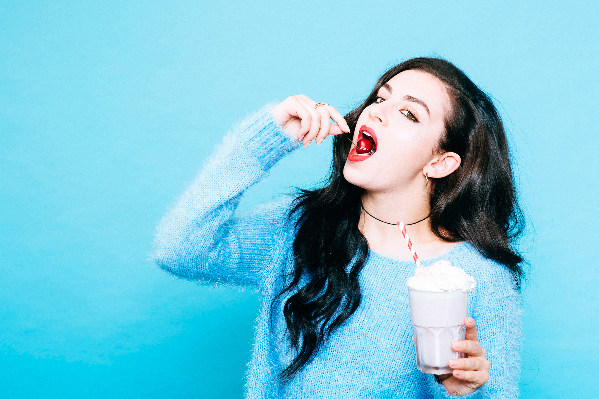 Charli XCX eating a cherry HD Wallpaper
