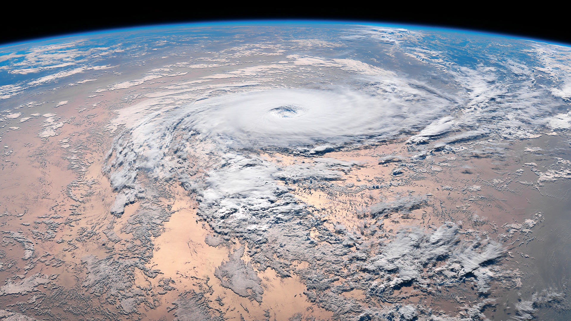 Hurricane viewed from space over Earth's surface HD Wallpaper