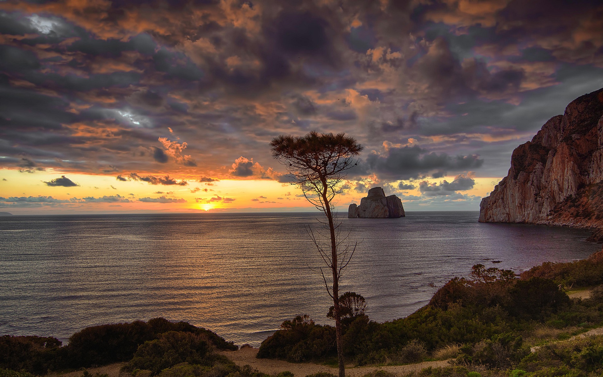 Sunset over the sea with rock formations HD Wallpaper