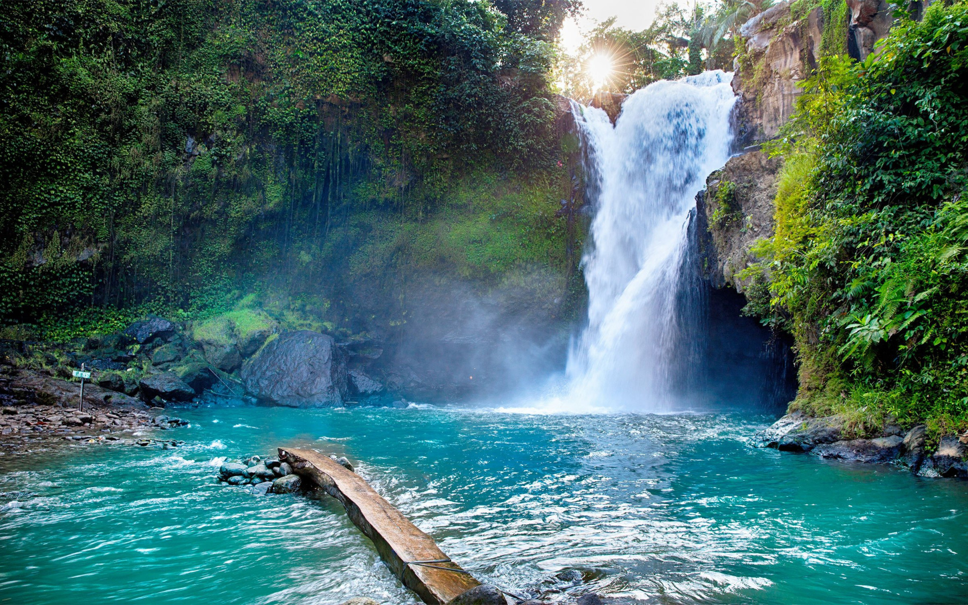 Waterfall with turquoise water and lush greenery HD Wallpaper