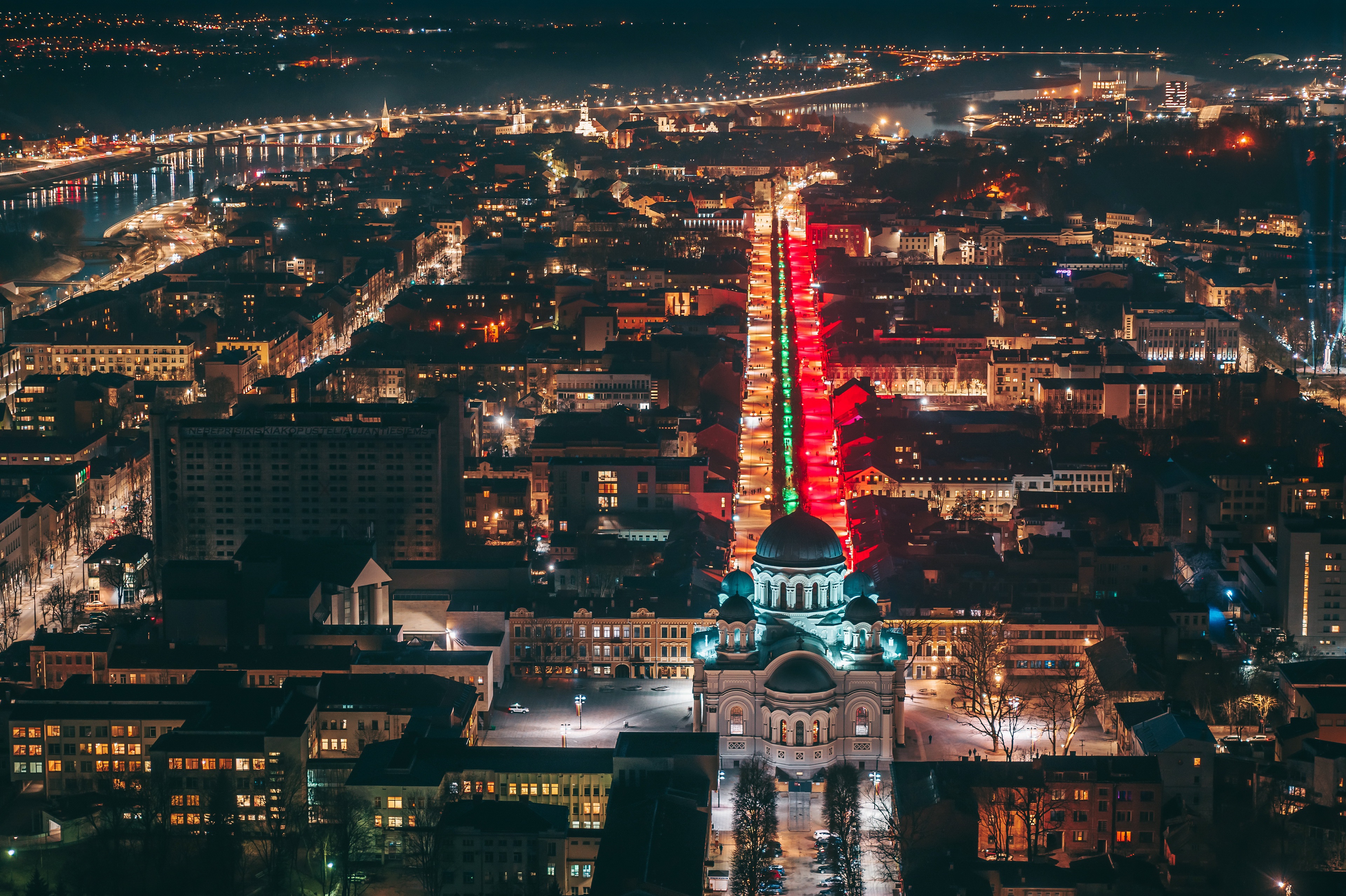Kaunas cityscape at night with illuminated street HD Wallpaper