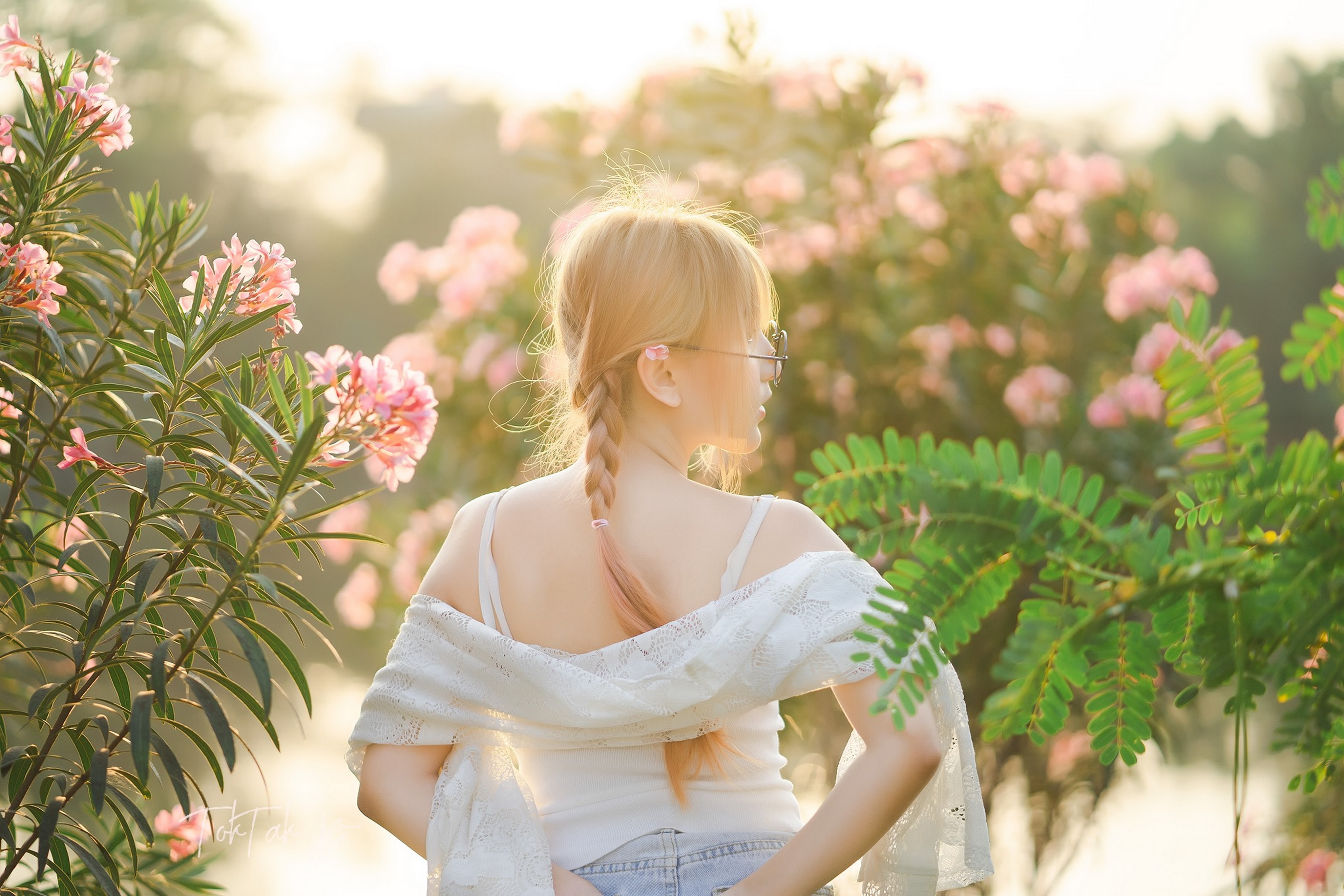 Asian woman with braided hair in a garden HD Wallpaper
