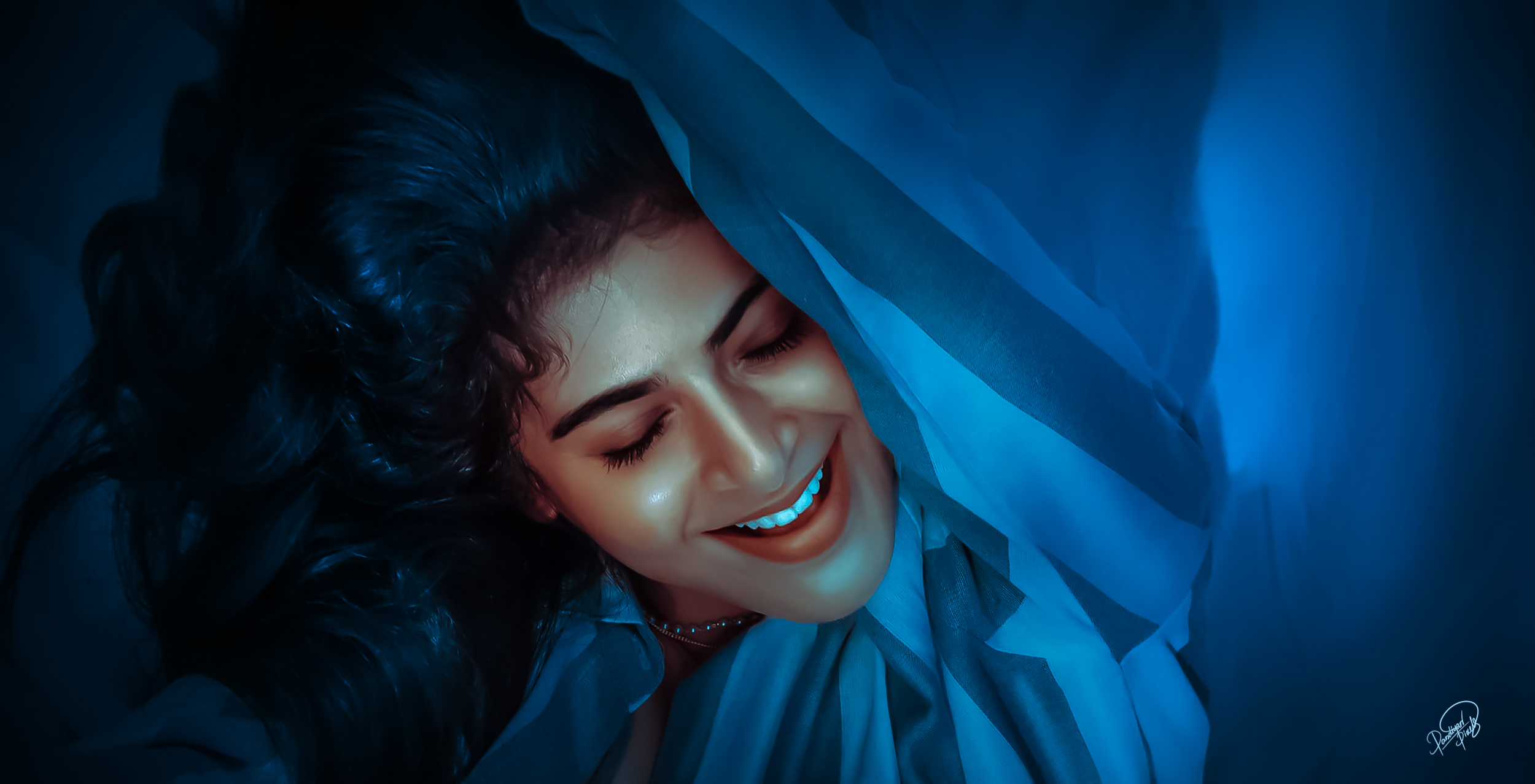 Iswarya Menon smiling under blue fabric HD Wallpaper