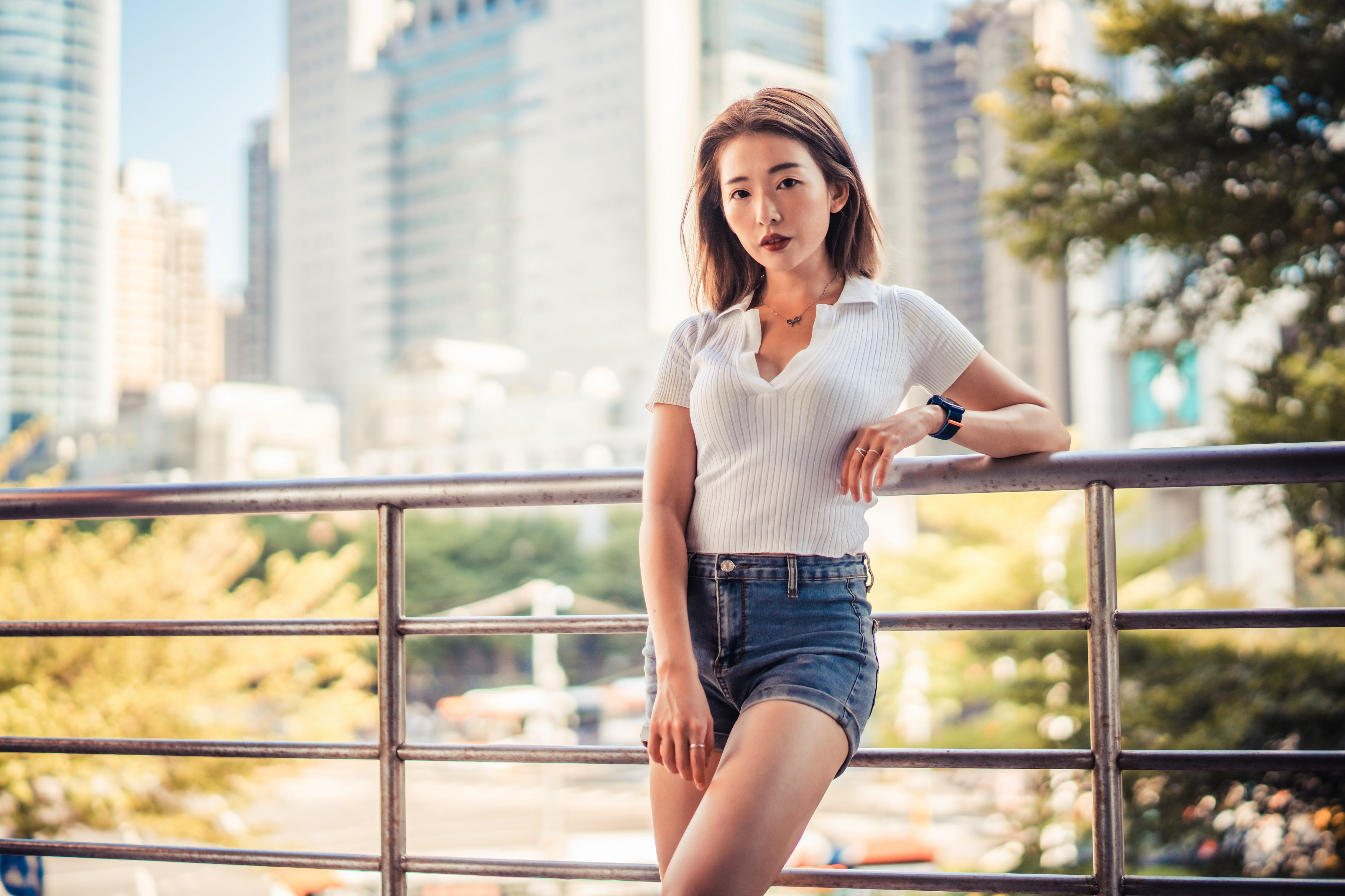Asian woman in white top and denim shorts HD Wallpaper