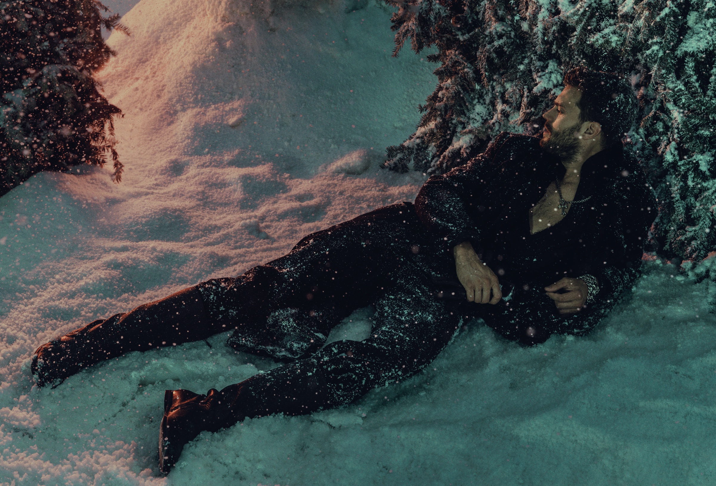 Jamie Dornan lying in the snow HD Wallpaper