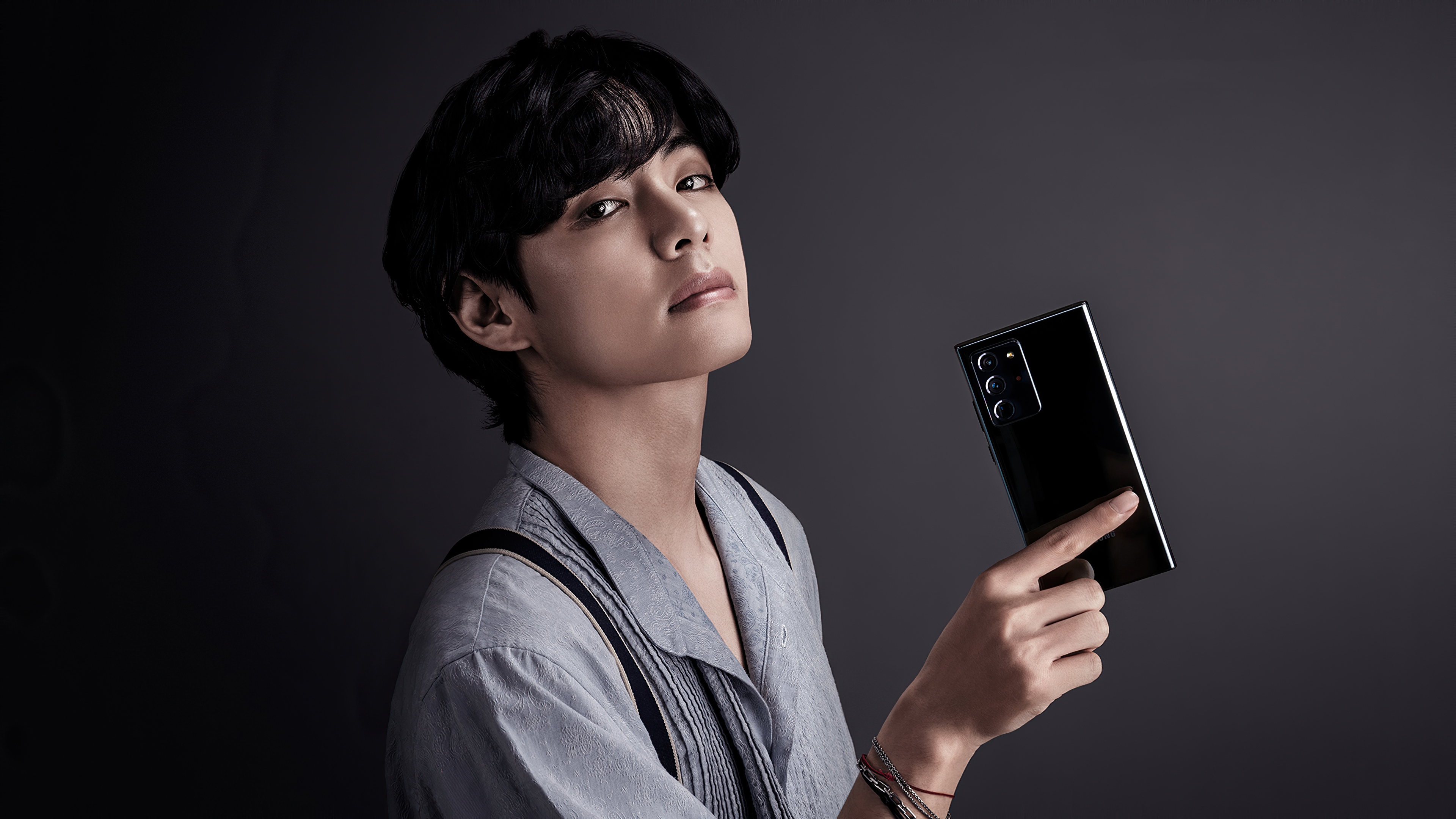 Kim Tae-hyung from BTS holding a Samsung Galaxy Note 20 Ultra 4K HD Wallpaper