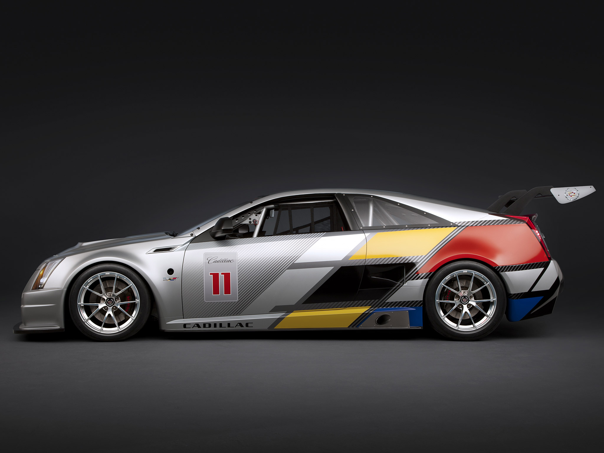 2011 Cadillac CTS-V Coupe race car with abstract art livery HD Wallpaper