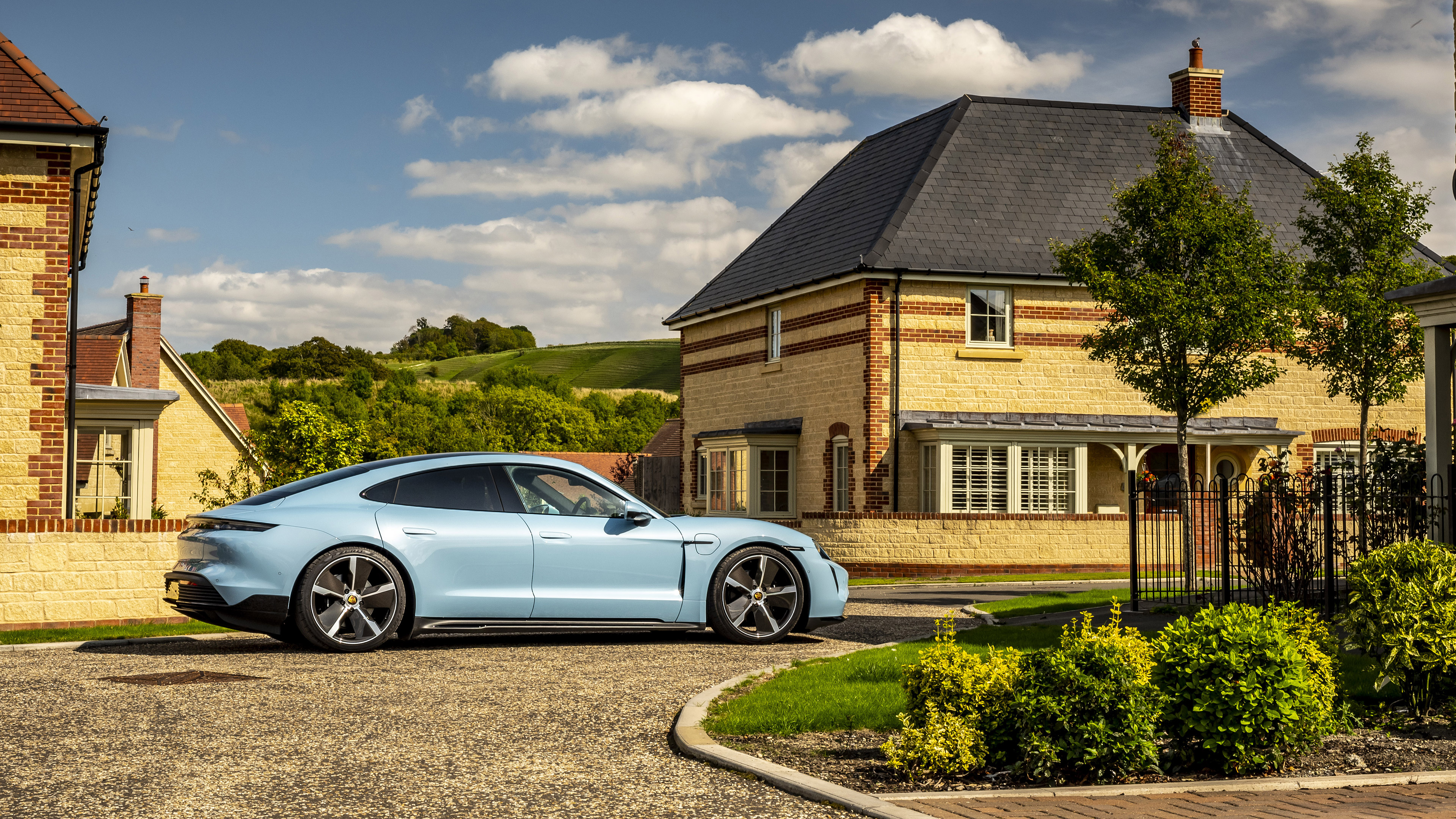 Blue Porsche Taycan 4S parked in front of a house HD Wallpaper