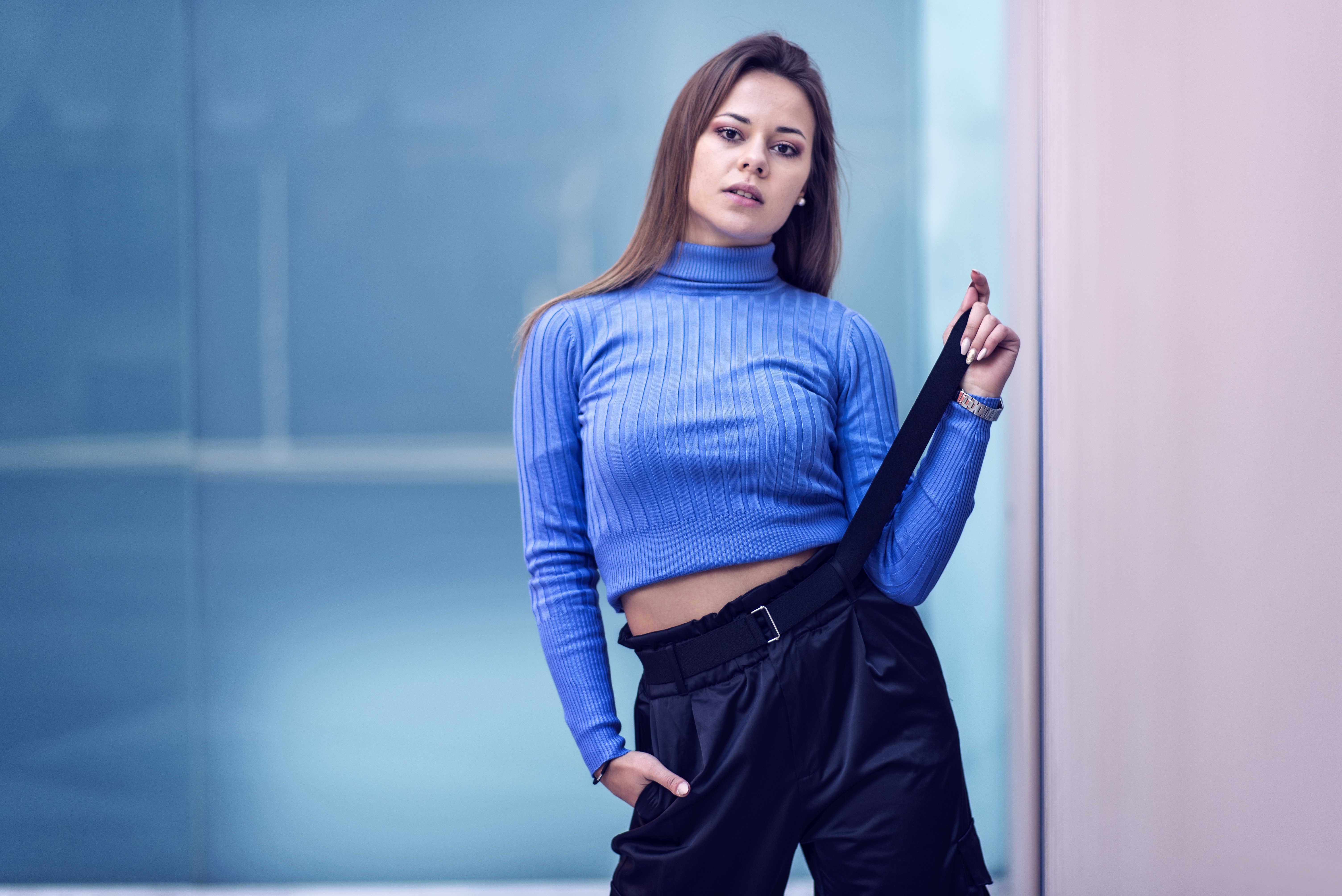 Woman in blue turtleneck and black pants HD Wallpaper