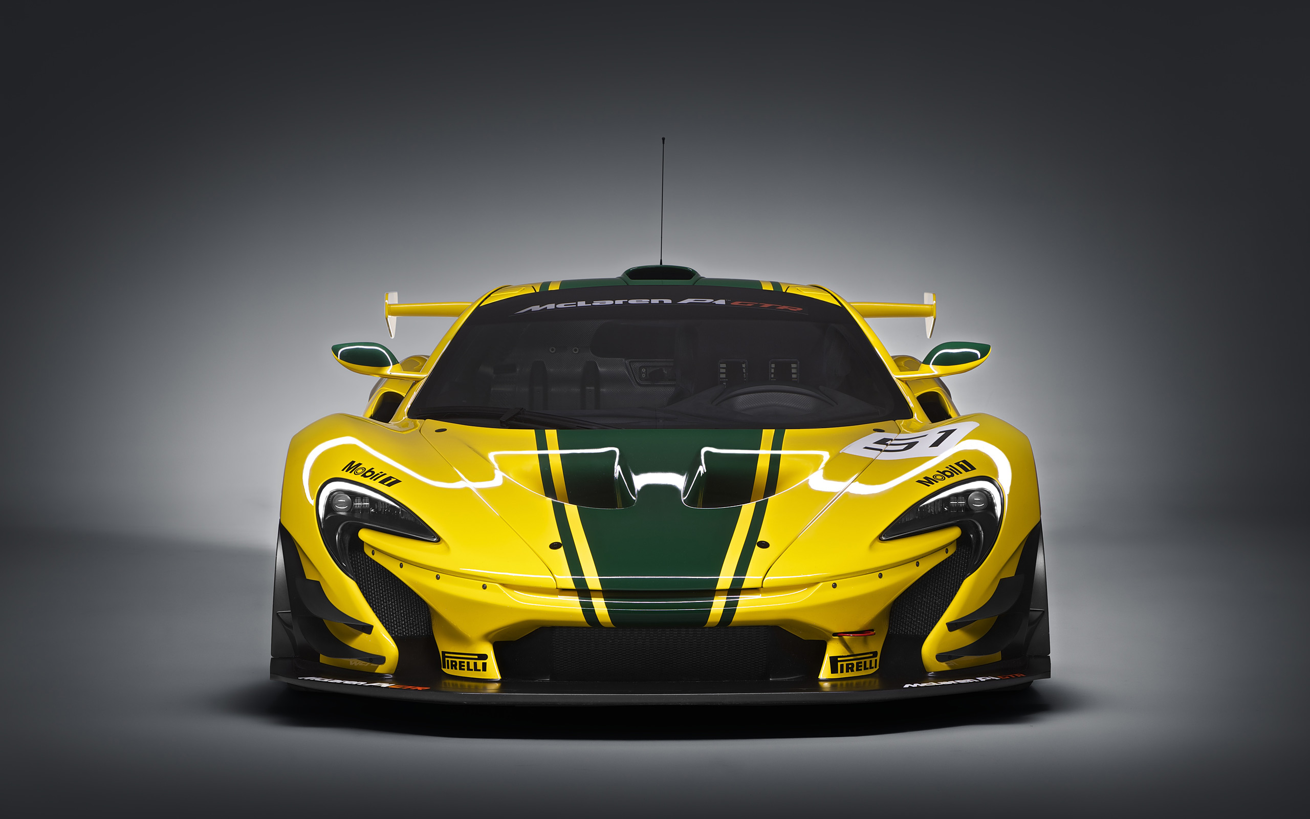 Yellow McLaren P1 GTR race car with green stripes HD Wallpaper