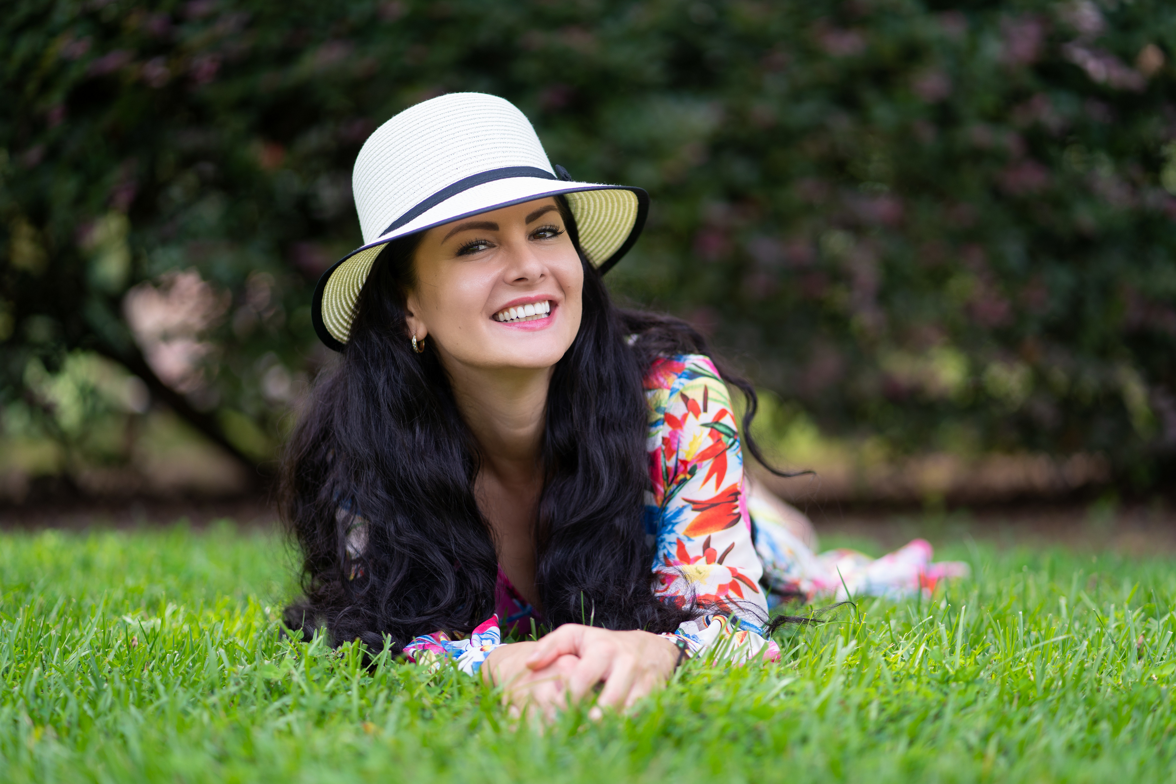 Woman in Hat Lying on Grass HD Wallpaper