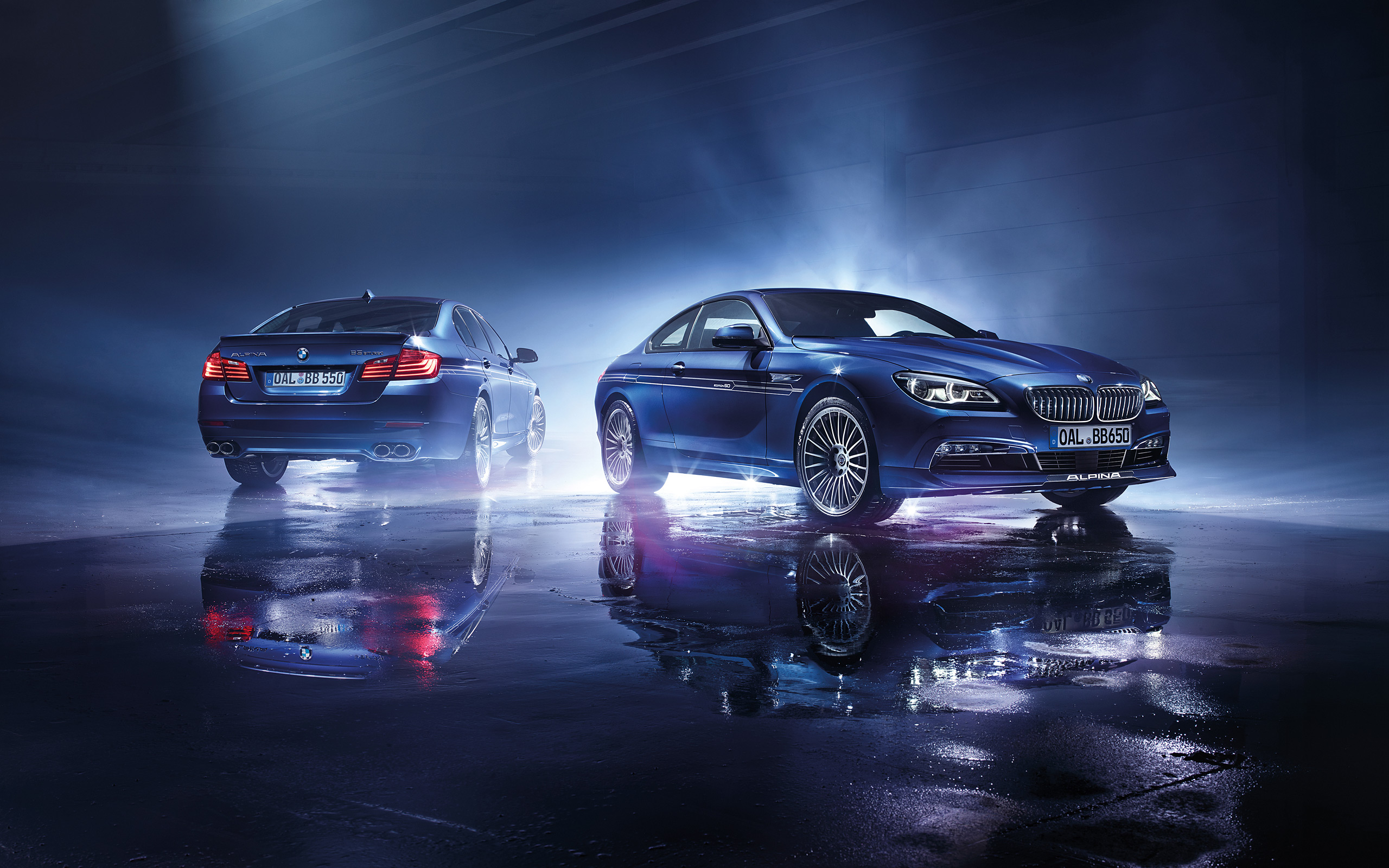 Two blue Alpina cars on a wet surface HD Wallpaper