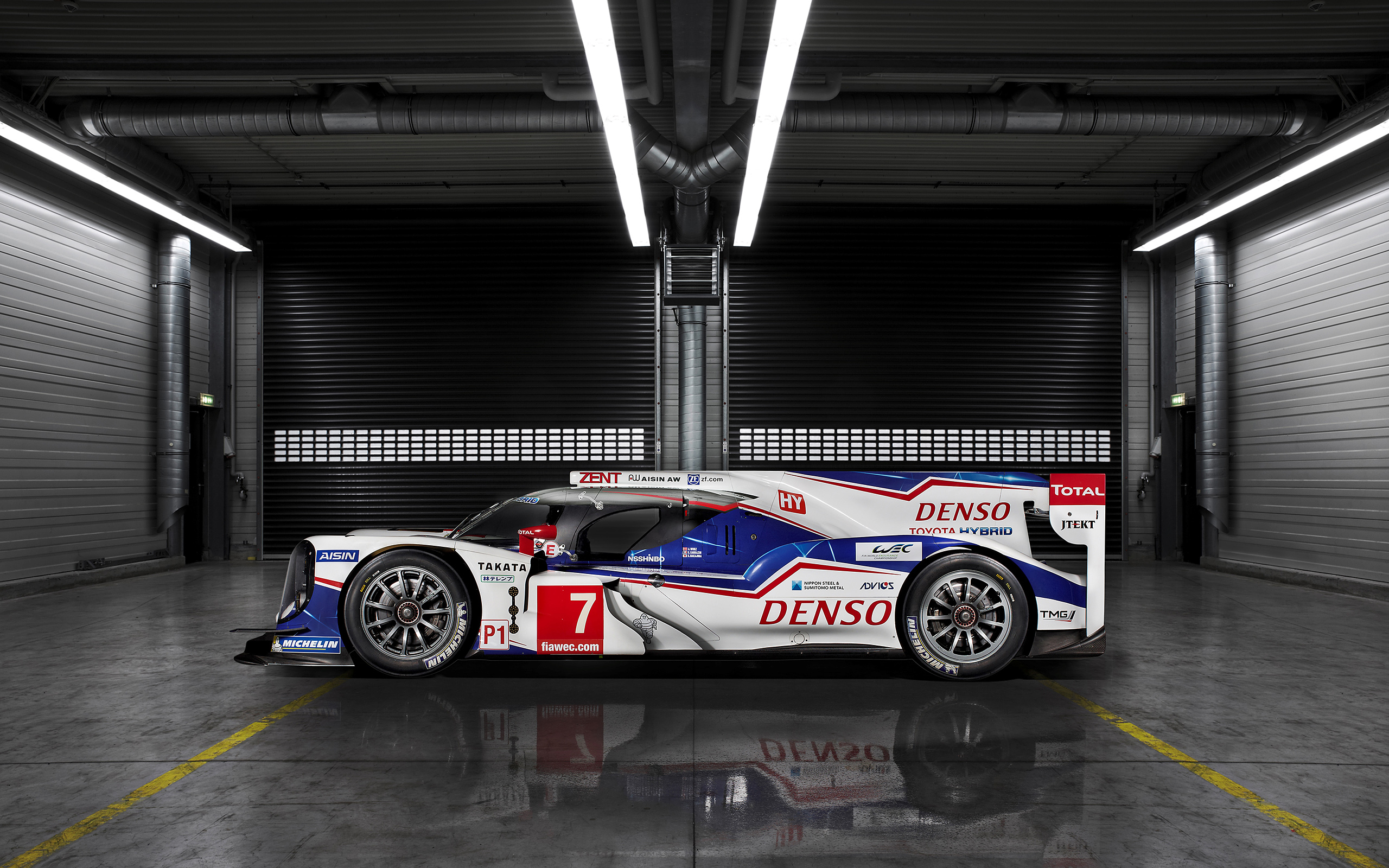 Toyota TS040 Hybrid race car with DENSO and TOTAL branding HD Wallpaper