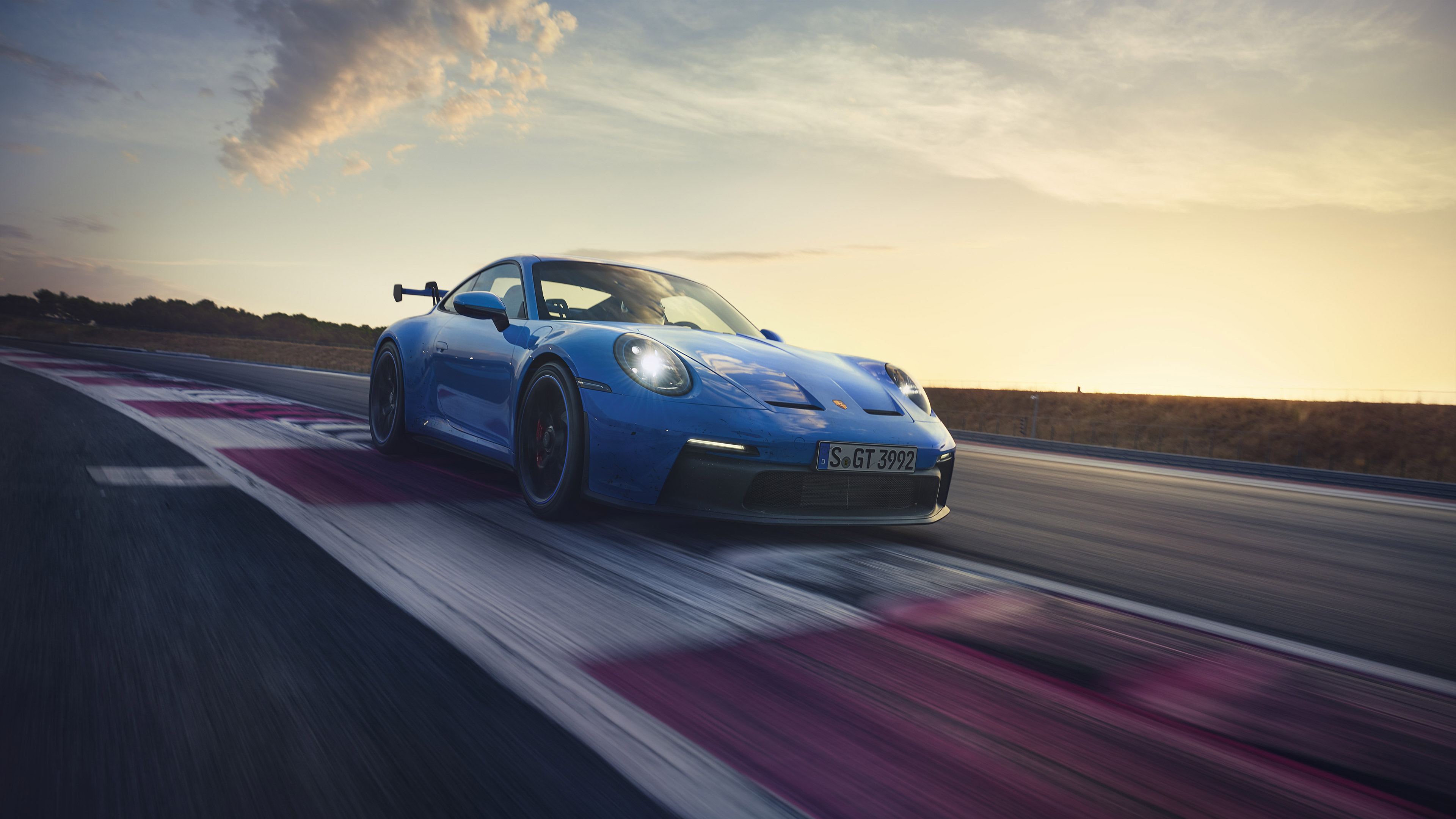 Blue Porsche 911 GT3 on a Racetrack HD Wallpaper