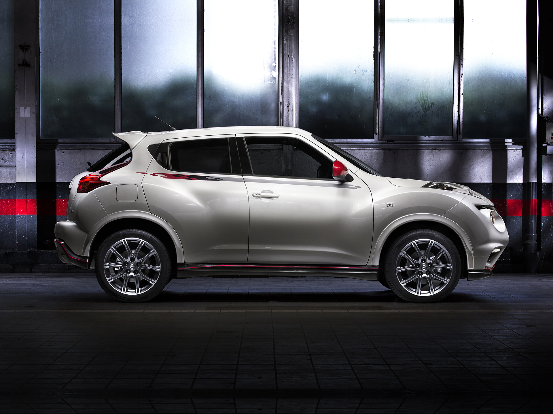 Silver Nissan Juke Nismo parked in a garage HD Wallpaper