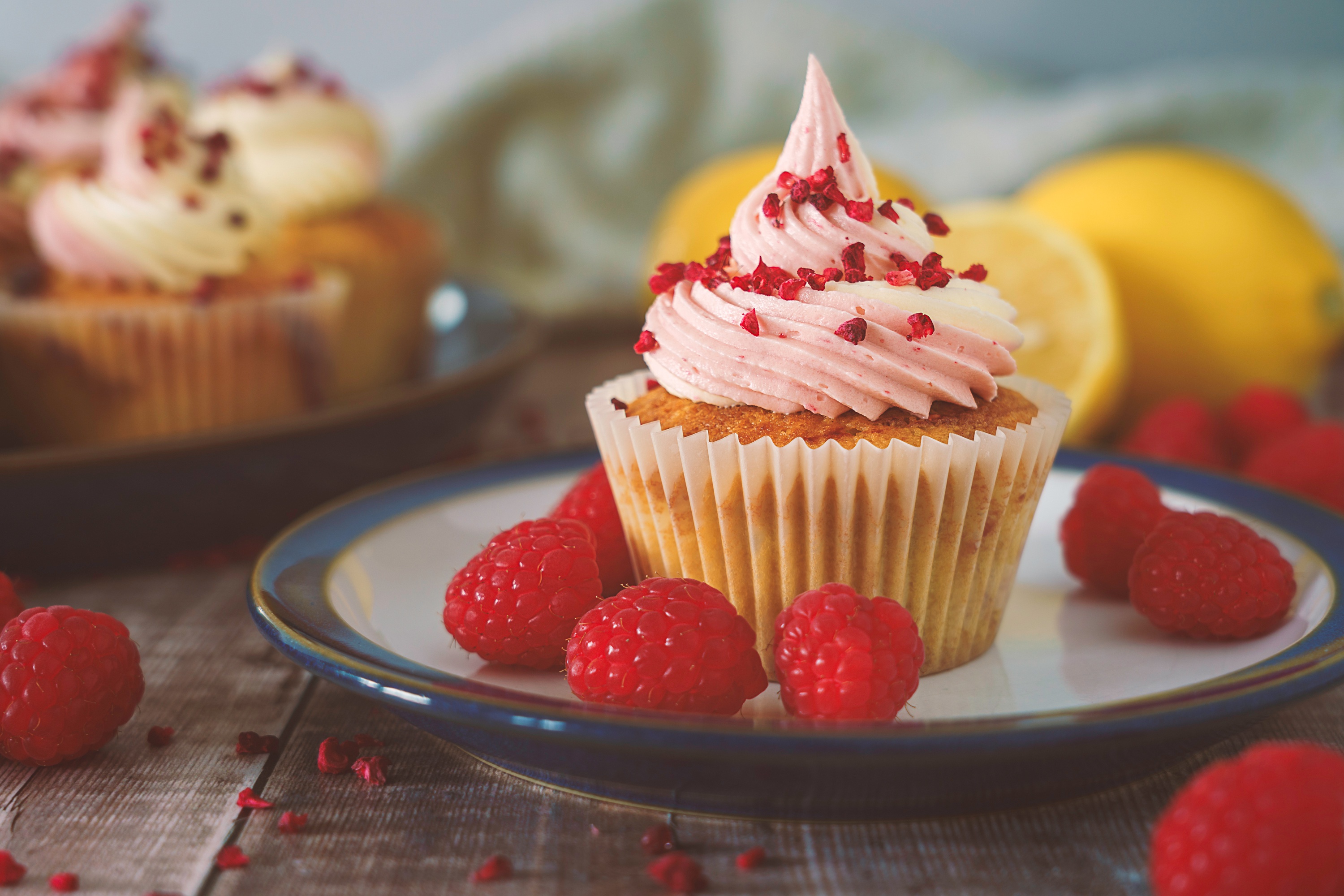 Raspberry Cupcakes with Pink Frosting and Fresh Berries HD Wallpaper
