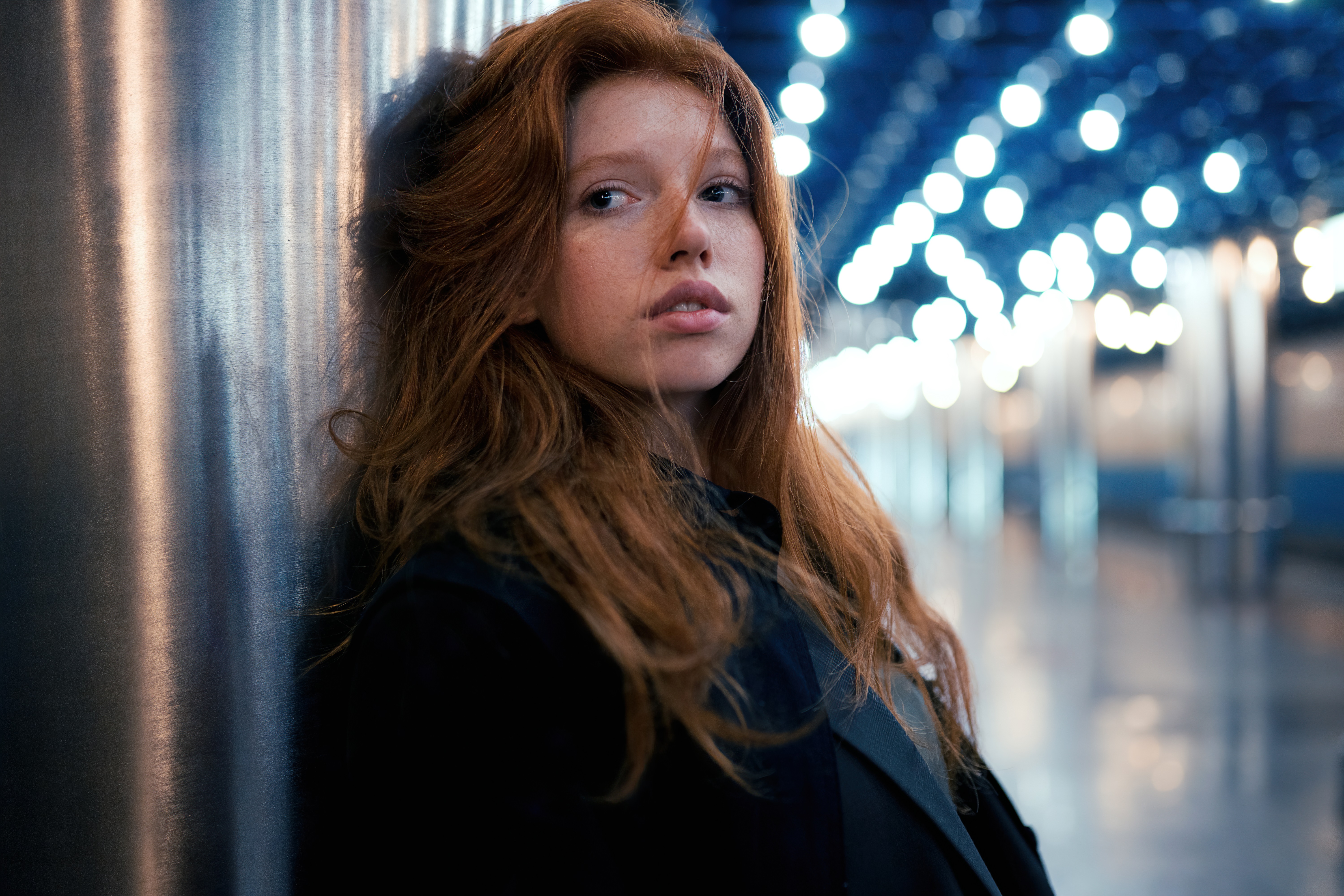 Red-haired woman with freckles in a dark jacket HD Wallpaper